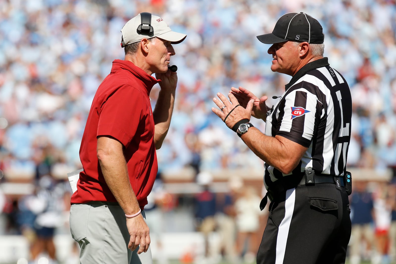 Oklahoma head coach Brent Venables discusses a call with line judge Michael Taylor during the first half of an NCAA college football game against Mississippi, Saturday, Oct. 26, 2024, in Oxford, Miss. (AP Photo/Sarah Warnock)