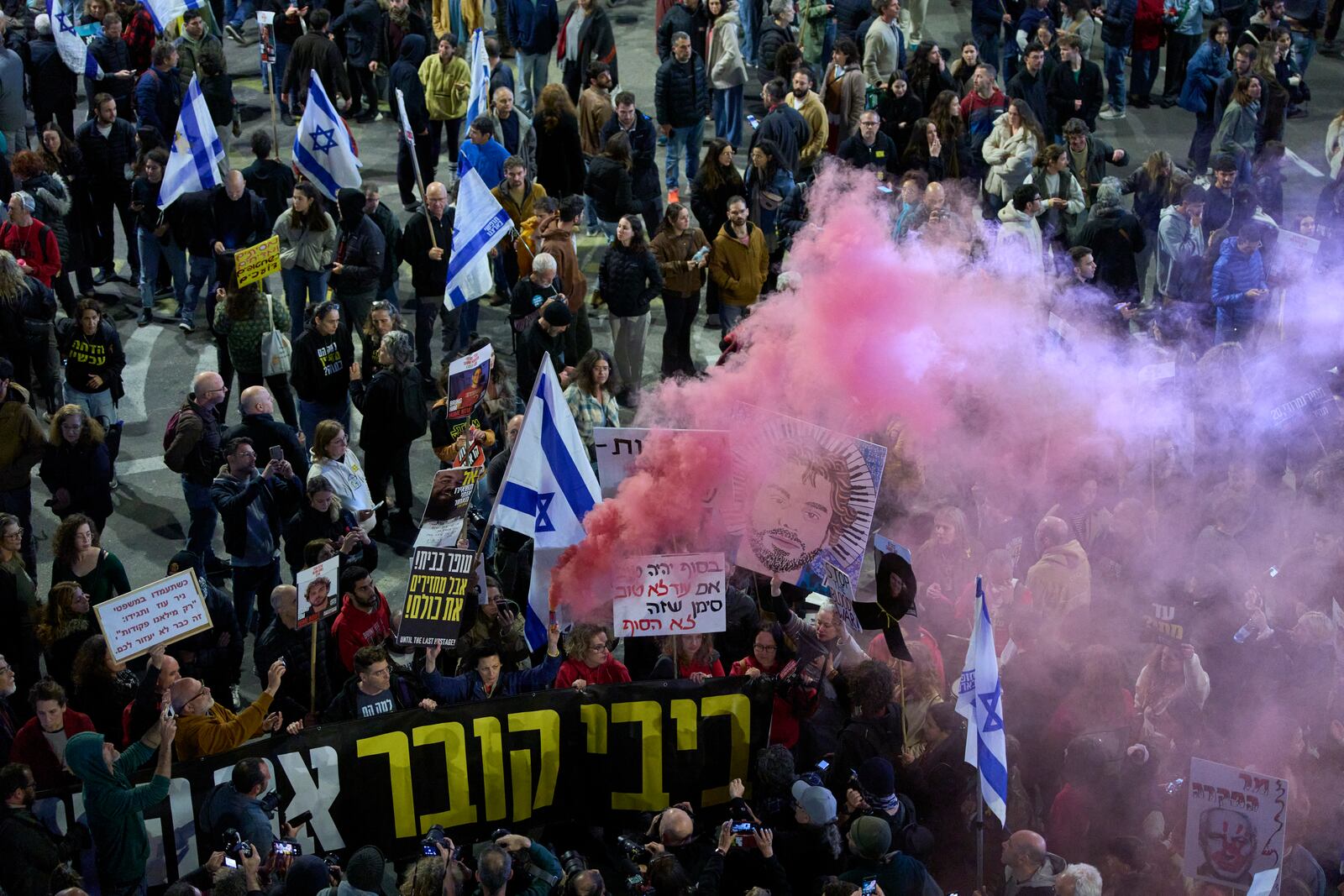 People take part in a protest demanding the immediate release of hostages held by Hamas in the Gaza Strip, in Tel Aviv, Israel, Saturday, March 22, 2025. (AP Photo/Ohad Zwigenberg)