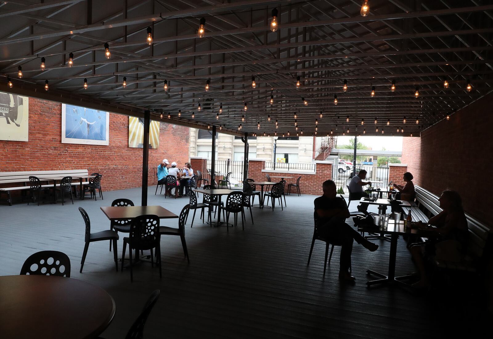 The outdoor patio at Stella Bleu Bistro in Springfield has a cover to protect customers from rain and heat. BILL LACKEY/STAFF