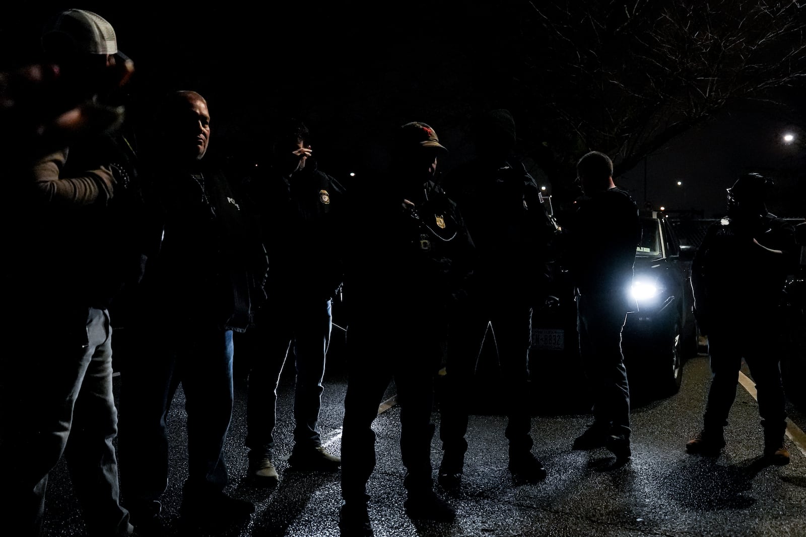 Enforcement and Removal Operations deportation officers with U.S. Immigration and Customs Enforcement's New York City field office conduct a brief before an early morning operation, Tuesday, Dec. 17, 2024, in the Bronx borough of New York. (AP Photo/Julia Demaree Nikhinson)