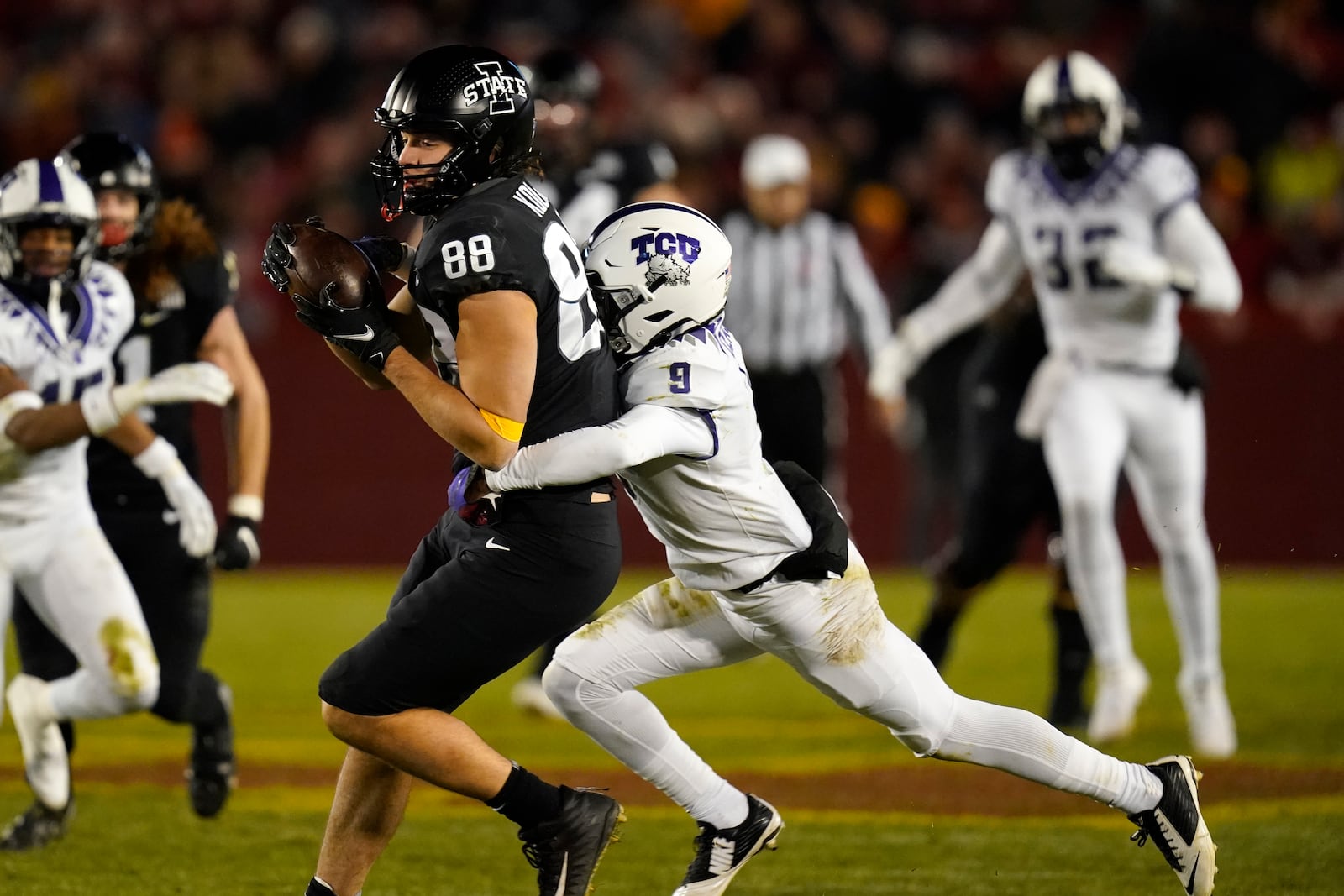 Iowa State tight end Charlie Kolar (88) catches a pass ahead of TCU cornerback C.J. Ceasar II (9) during the second half an NCAA college football game, Friday, Nov. 26, 2021, in Ames, Iowa. Iowa State won 48-14. (AP Photo/Charlie Neibergall)