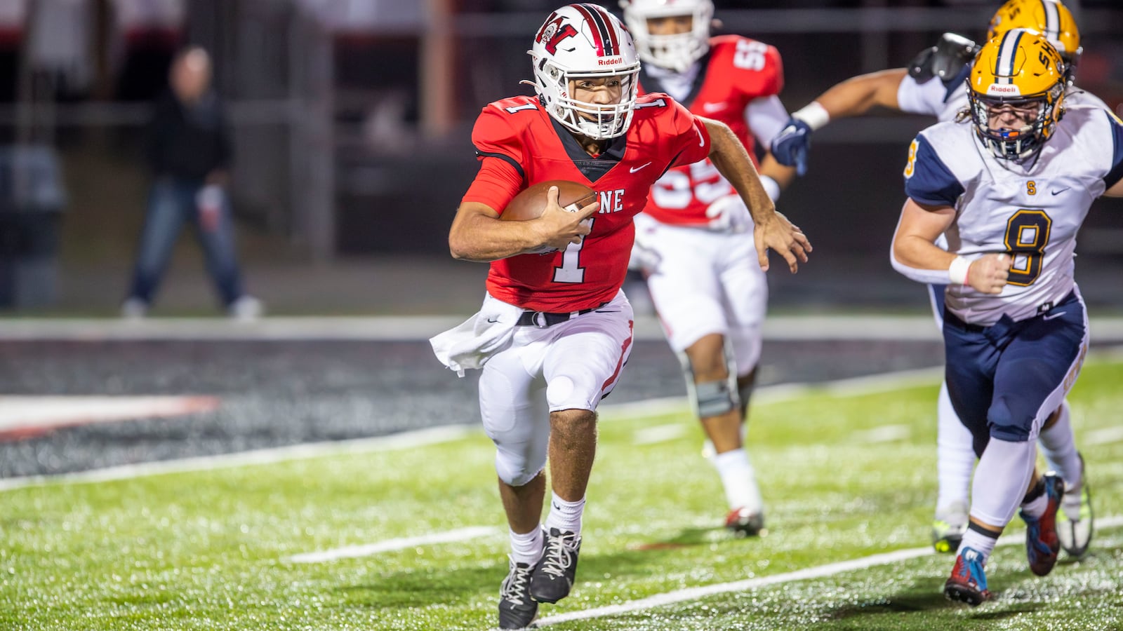 Wayne High School quarterback Tyrell Lewis scrambles during their game against Springfield on Friday night in Huber Heights. The Wildcats won 38-14. Michael Cooper/CONTRIBUTED