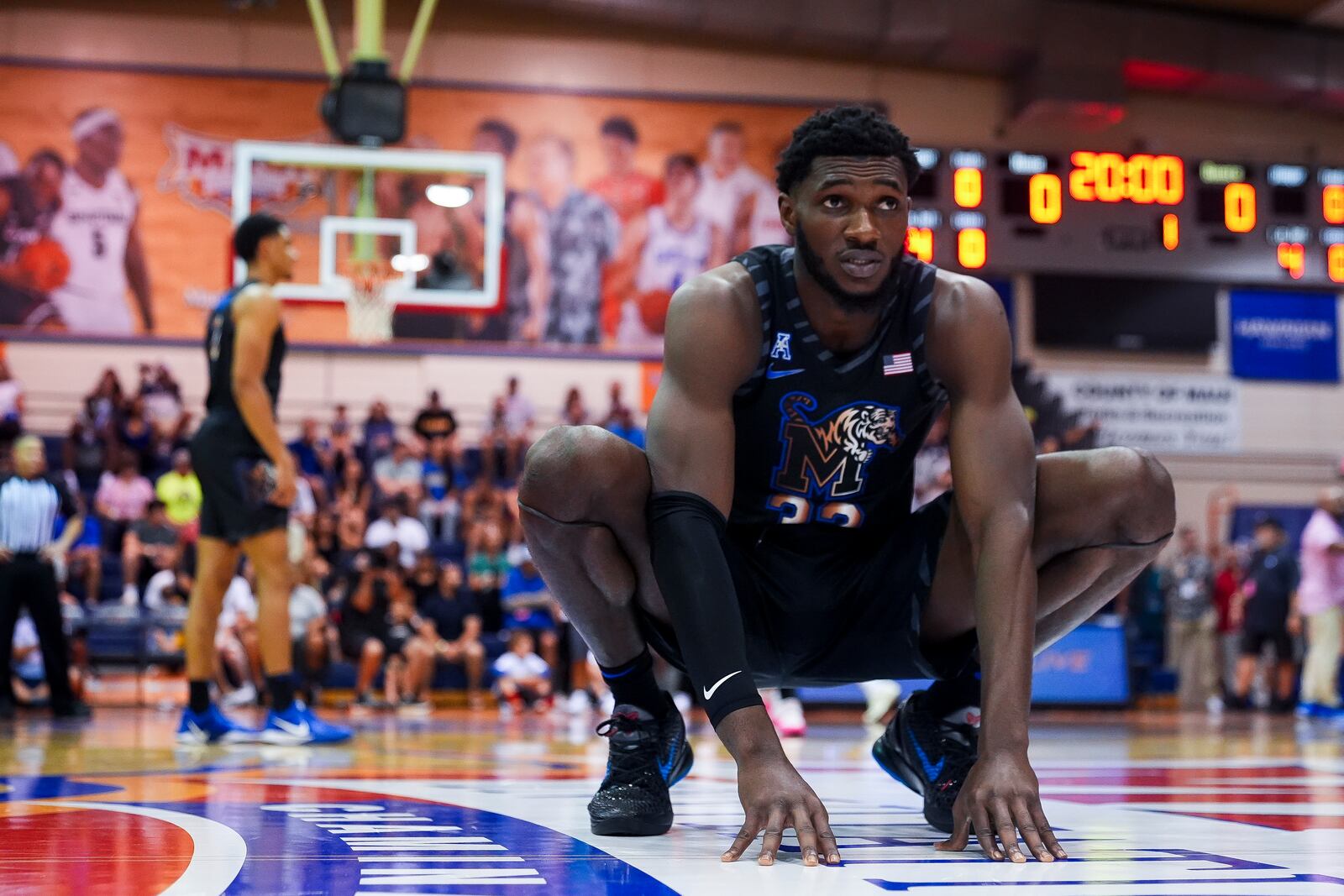 Memphis center Moussa Cisse stretches before an NCAA college basketball game against UConn at the Maui Invitational Monday, Nov. 25, 2024, in Lahaina, Hawaii. (AP Photo/Lindsey Wasson)