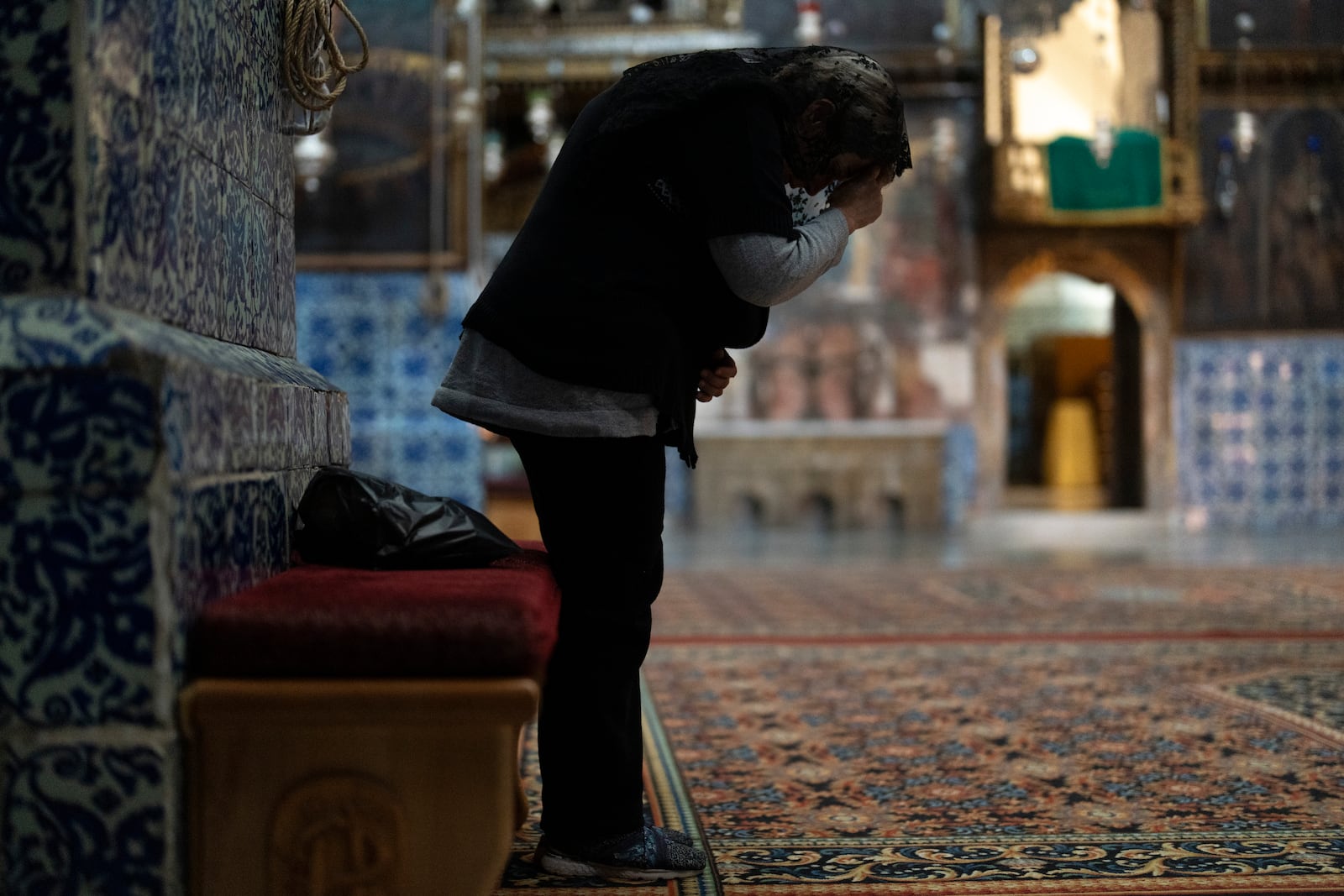 An Armenian Christian worshipper attends the daily afternoon prayer service at the St. James Cathedral at the Armenian quarter in Jerusalem, Thursday, Nov. 21, 2024. (AP Photo/Francisco Seco)