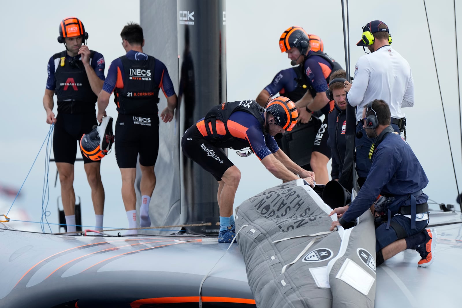 Ineos Britannia crew prepares for the Louis Vuitton 37th America's Cup Day 5 race 7 in Barcelona, Spain, Friday, Oct. 18, 2024. (AP Photo/Bernat Armangue)