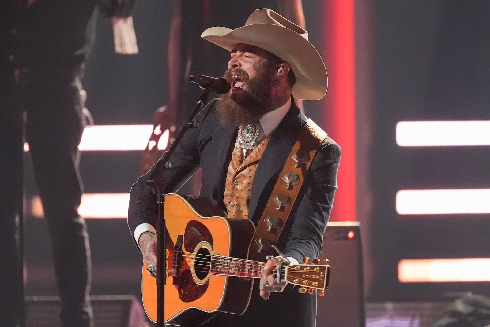 Post Malone performs during the 58th Annual CMA Awards on Wednesday, Nov. 20, 2024, at Bridgestone Arena in Nashville, Tenn. (AP Photo/George Walker IV)