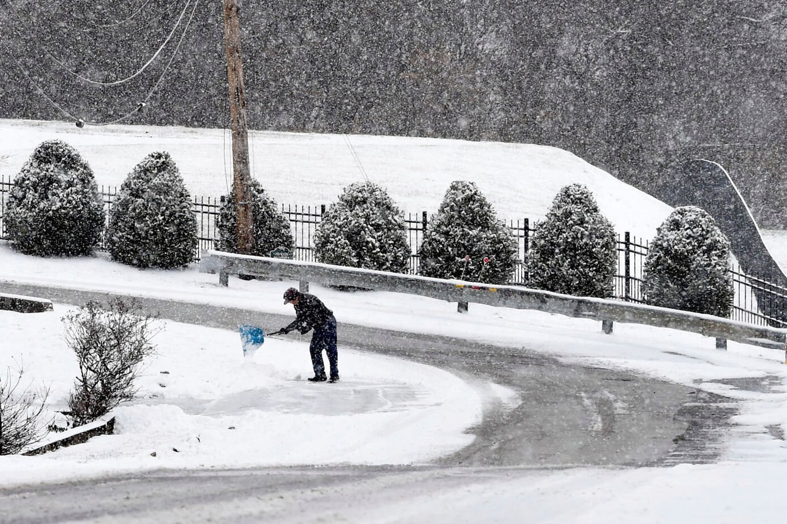 John Kee, 82, shovels snow from his driveway in Charleston, W.Va., Wednesday, Feb. 19, 2025. (Chris Dorst/Charleston Gazette-Mail via AP)