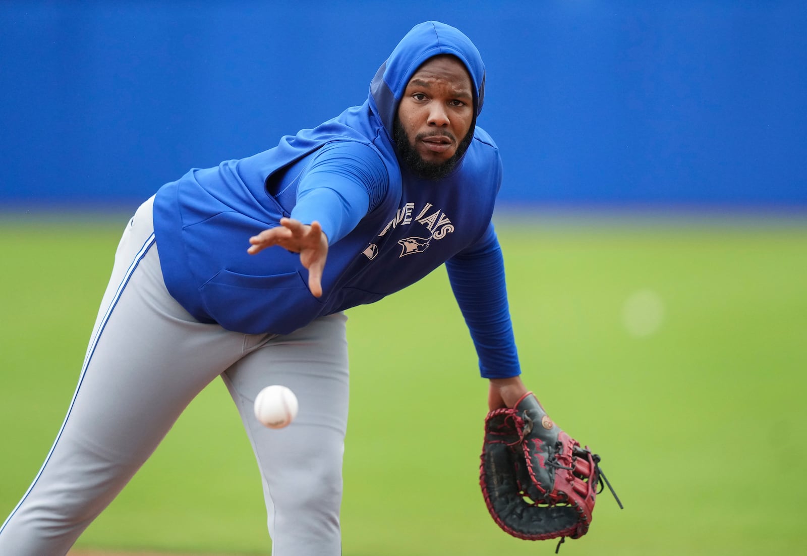 Toronto Blue Jays first baseman Vladimir Guerrero Jr. throws the ball to first base during spring training baseball workouts in Dunedin Fla., Thursday, Feb. 20, 2025. (Nathan Denette/The Canadian Press via AP)