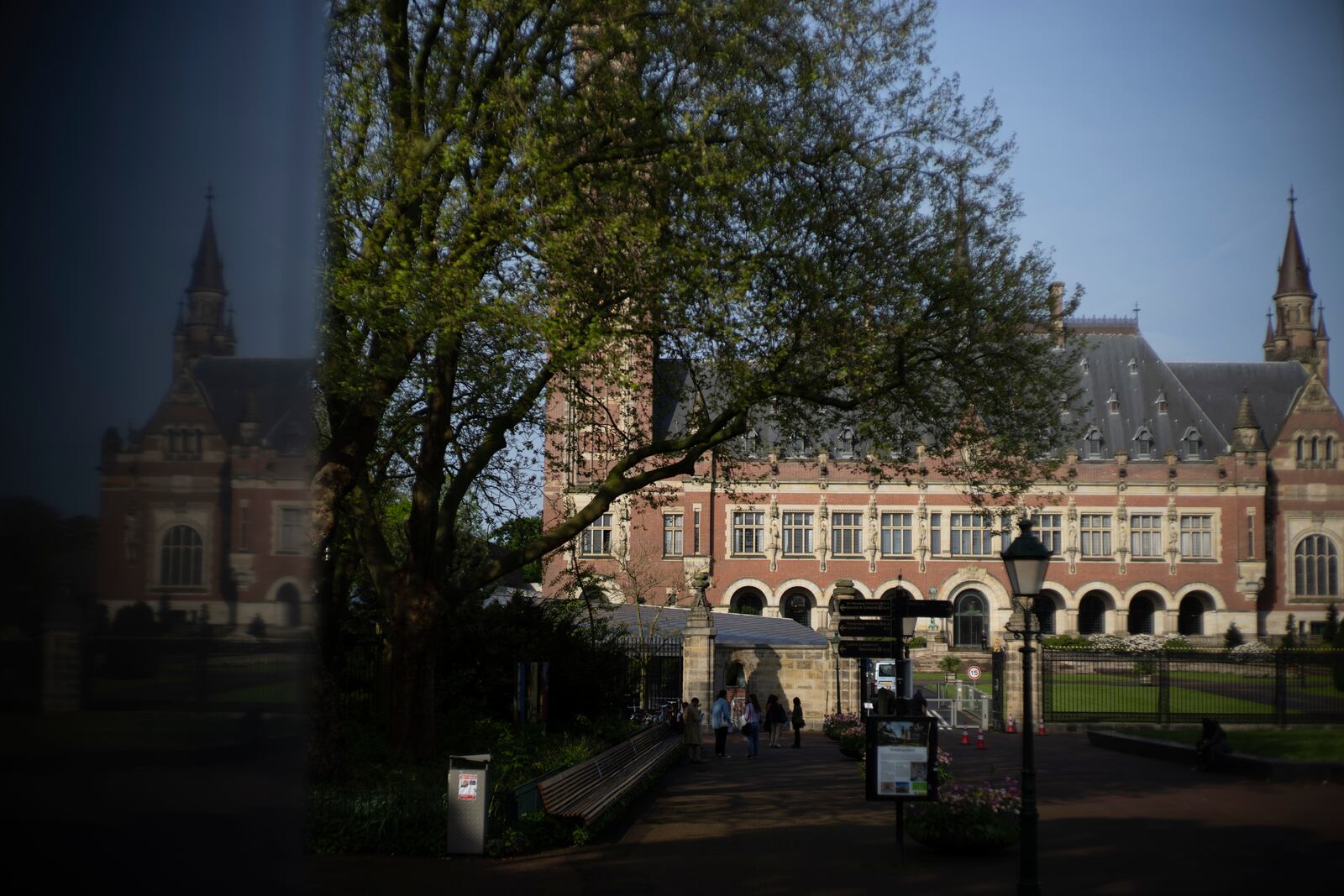 FILE - The Peace Palace housing the World Court, or International Court of Justice, is reflected in a monument in The Hague, Netherlands, Wednesday, May 1, 2024. (AP Photo/Peter Dejong, File)