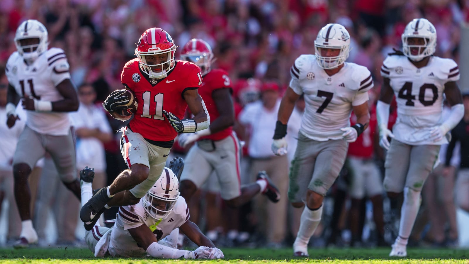 Georgia wide receiver Arian Smith (11) runs the ball during an NCAA college football game against Mississippi State, Saturday, Oct. 12, 2024, in Athens, Ga. (AP Photo/Jason Allen)