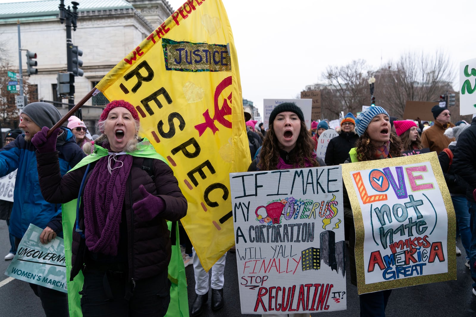 Demonstrators protest President-elect Donald Trump's incoming administration during the People's March, Saturday, Jan. 18, 2025, in Washington. (AP Photo/Jose Luis Magana)