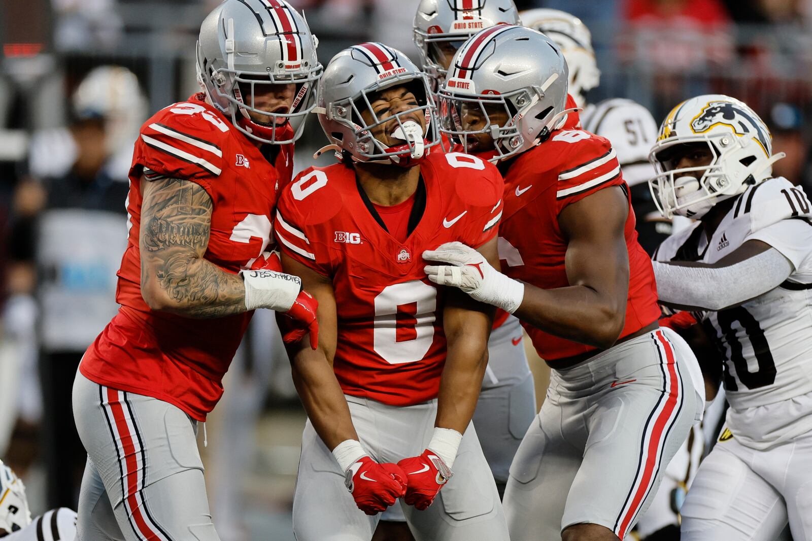 FILE - Ohio State linebacker Cody Simon (0) celebrates with teammates after his sack against Western Michigan during the first half of an NCAA college football game Saturday, Sept. 7, 2024, in Columbus, Ohio. (AP Photo/Jay LaPrete, File)