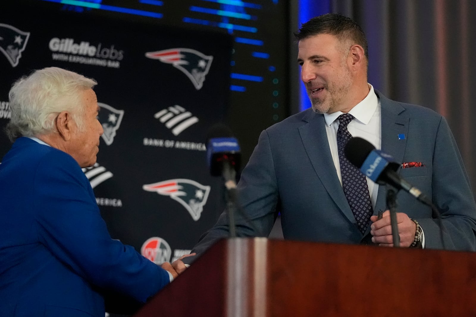 New England Patriots head coach Mike Vrabel, right, shakes hands with team owner Robert Kraft while being introduced during an availability, Monday, Jan. 13, 2025, in Foxborough, Mass. (AP Photo/Charles Krupa)