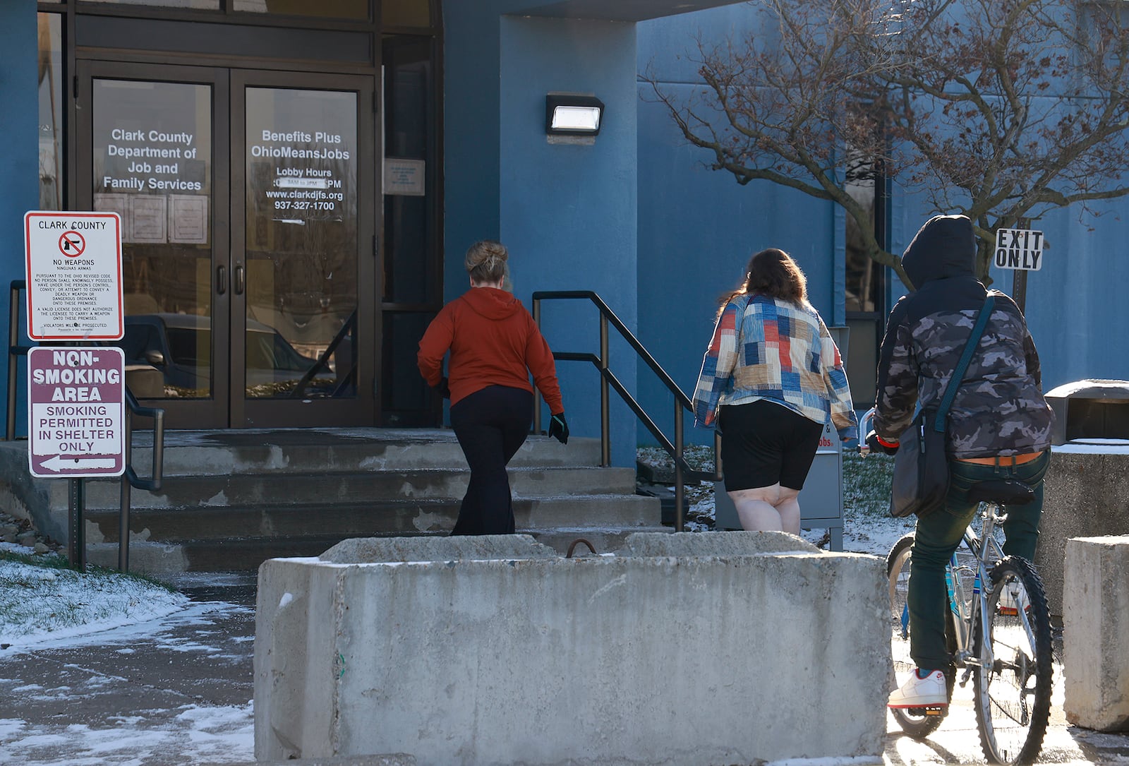 People enter the Clark County Department of Job and Family Services Thursday, Dec. 12, 2024. BILL LACKEY/STAFF