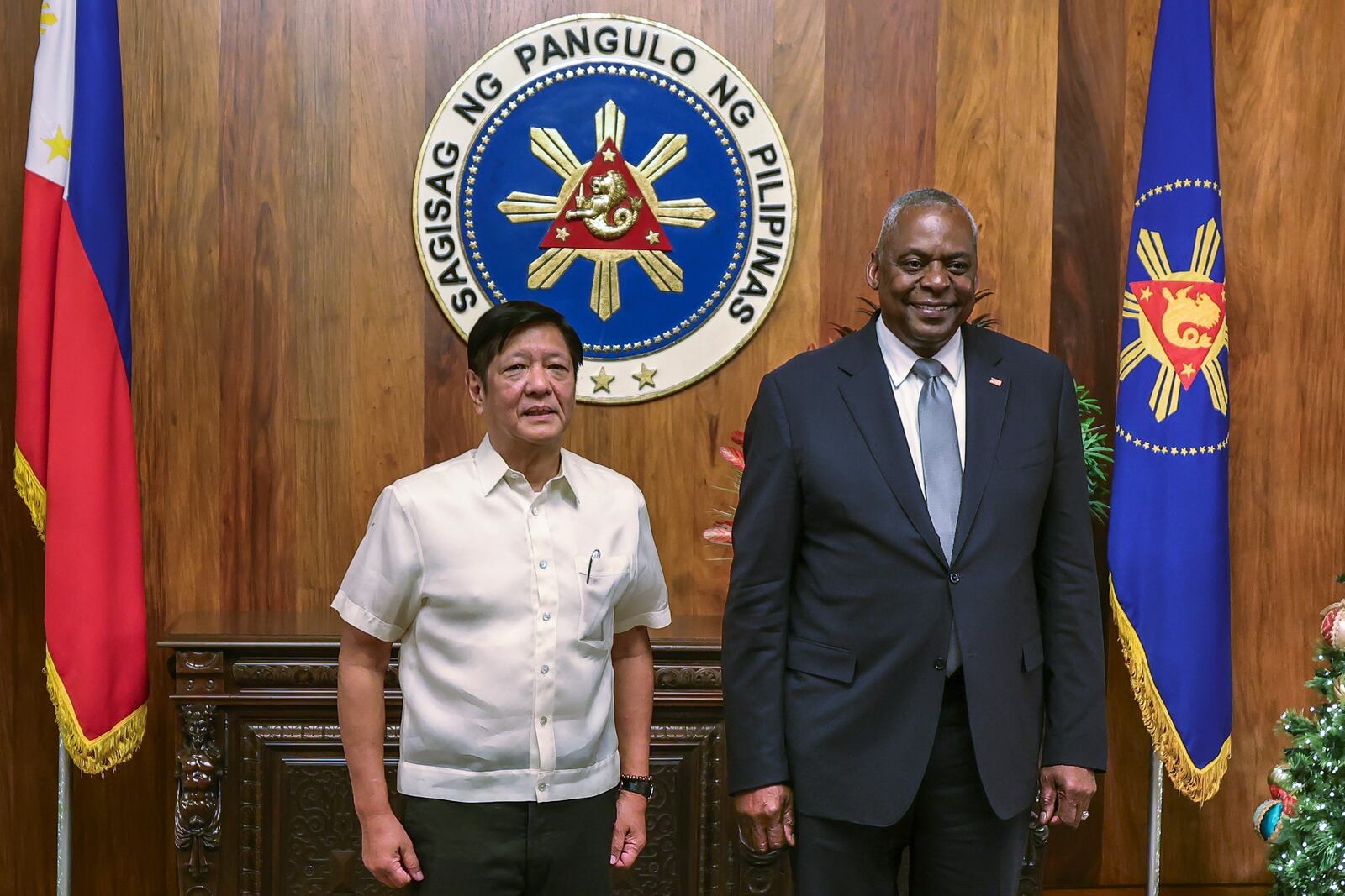 U.S. Defense Secretary Lloyd Austin, right, and Philippine President Ferdinand Marcos Jr. pose for a photograph during a courtesy call at the Malacanang Palace in Manila, Philippines Monday, Nov. 18, 2024. (AP Photo/Gerard Carreon, Pool)