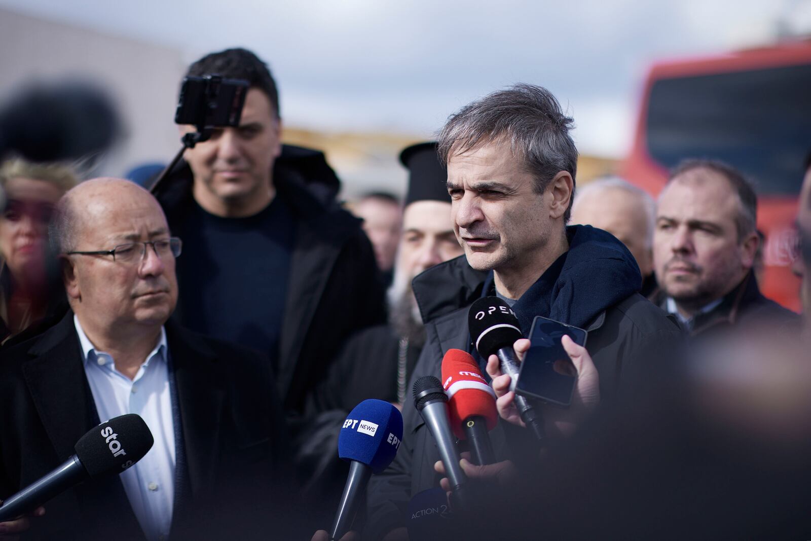 Greek Prime Minister Kyriakos Mitsotakis, right, speaks to the press next to Santorini Mayor Nikos Zorzos in the volcanic island of Santorini, on Friday, Feb. 7, 2025, as earthquakes are still rattling the Island. (Dimitris Papamitsos/Greek Prime Minister's Office via AP)