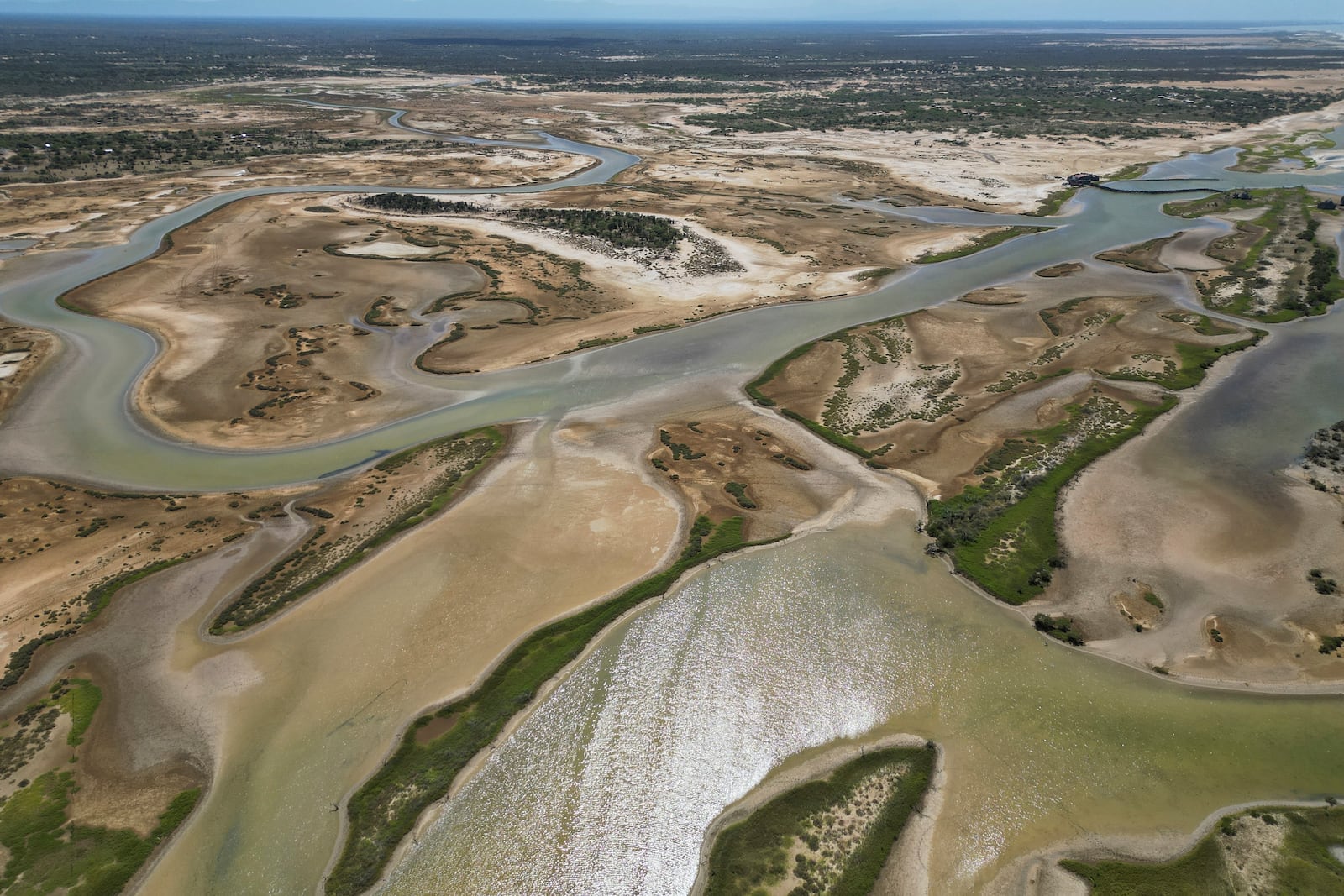 A river that connects to the Caribbean Sea flows through Mayapo, Colombia, Thursday, Feb. 6, 2025. (AP Photo/Ivan Valencia)