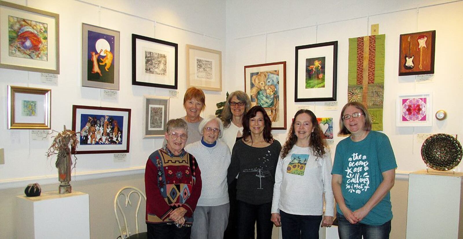 A Village Artisans lobby show with members (back row) Barbara Vandecreek and Amy Achor and (front row) Ann Bain, Sue Brezine, Kathryn Pitstick, Theresa Mayer, and Pam Geisel.