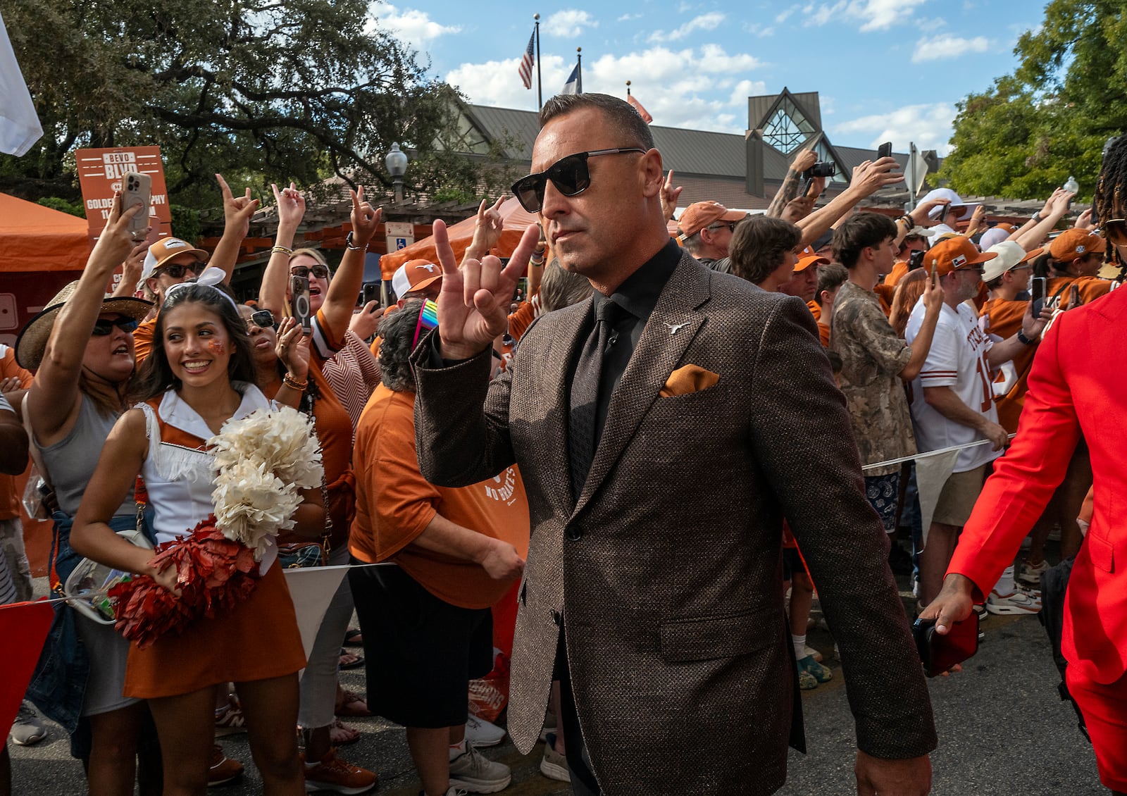 Texas head coach Steve Sarkisian and the Longhorns enter the Darrell K Royal Texas Memorial Stadium before facing off against Georgia in an NCAA college football game in Austin, Texas, Saturday, Oct. 19, 2024. (AP Photo/Rodolfo Gonzalez)