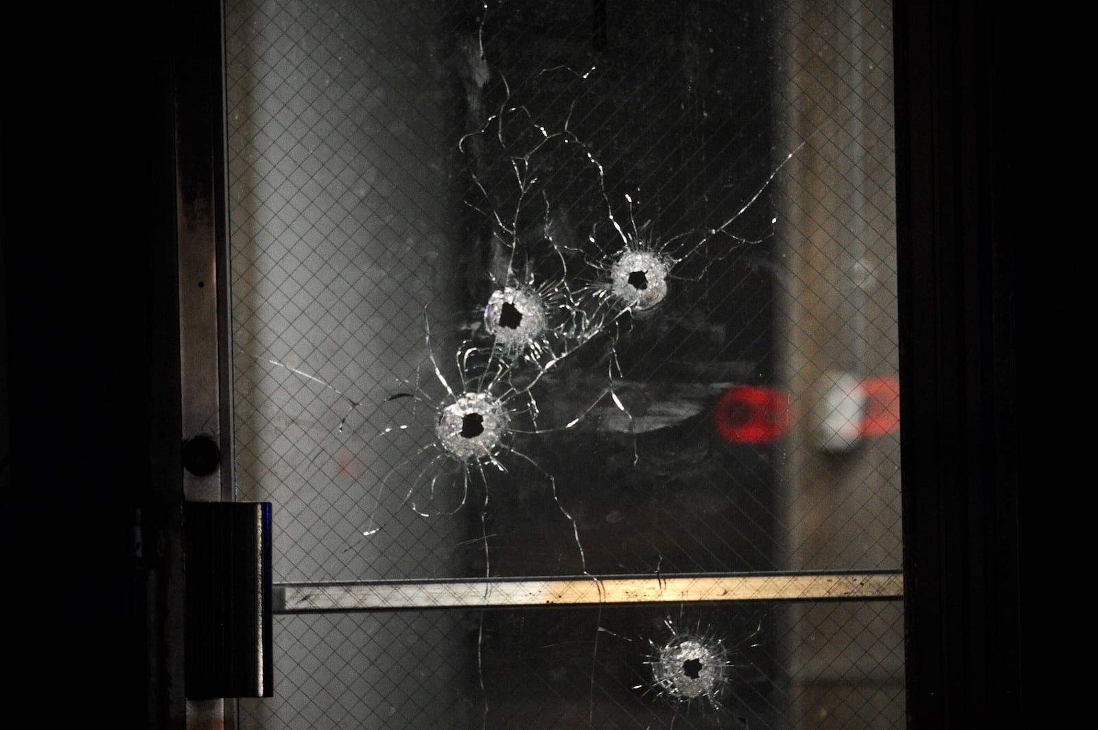 Bullet holes were seen in a door at the scene of a shooting in Springfield that sent six people to the hospital| MARSHALL GORBY