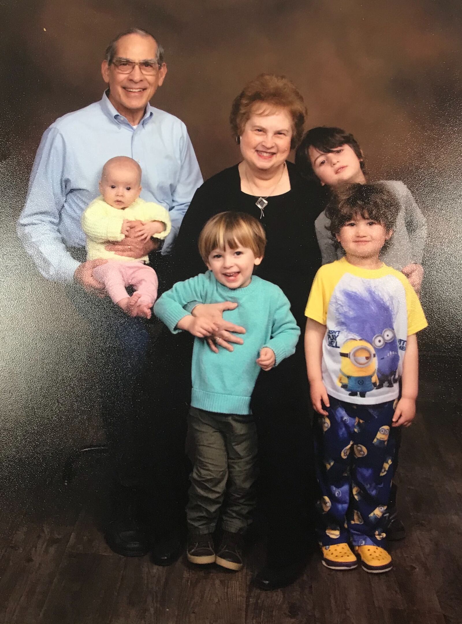 Meredith Moss  with her husband Jim Levinson  and four grandchildren.