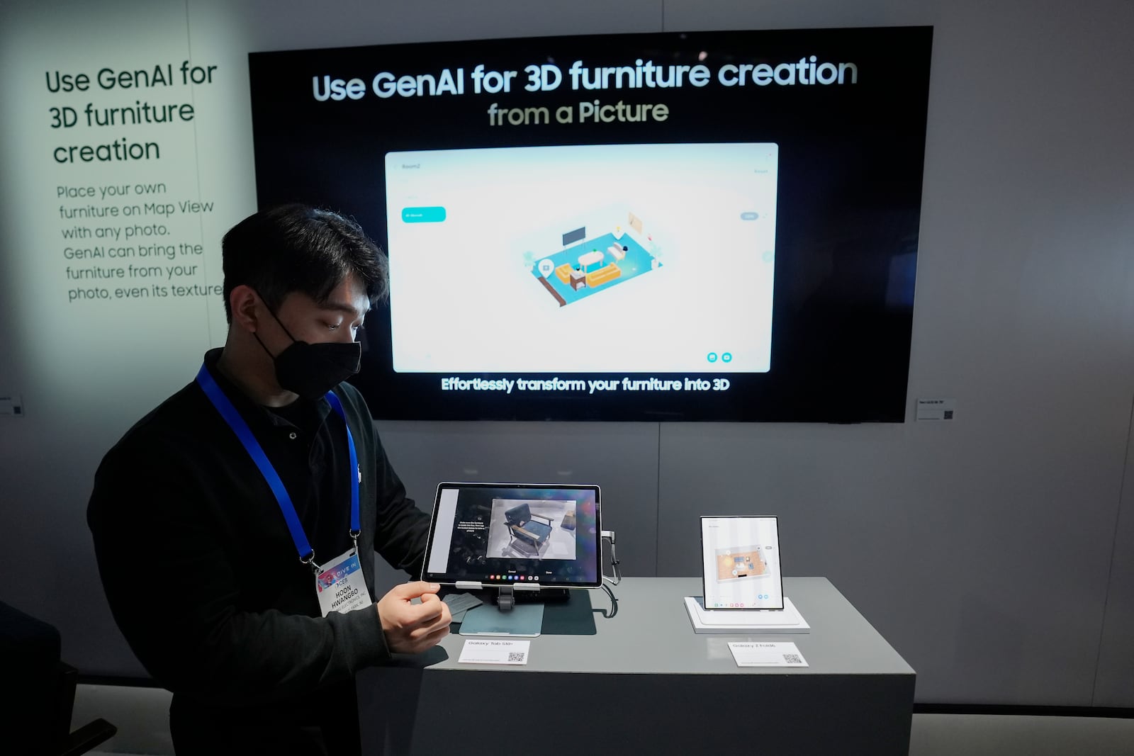 A Samsung employee shows how electronics using the Connected Home Experience powered by Samsung SmartThings uses GenAI for 3D furniture creation at a Samsung booth during the CES tech show Tuesday, Jan. 7, 2025, in Las Vegas. (AP Photo/Abbie Parr)