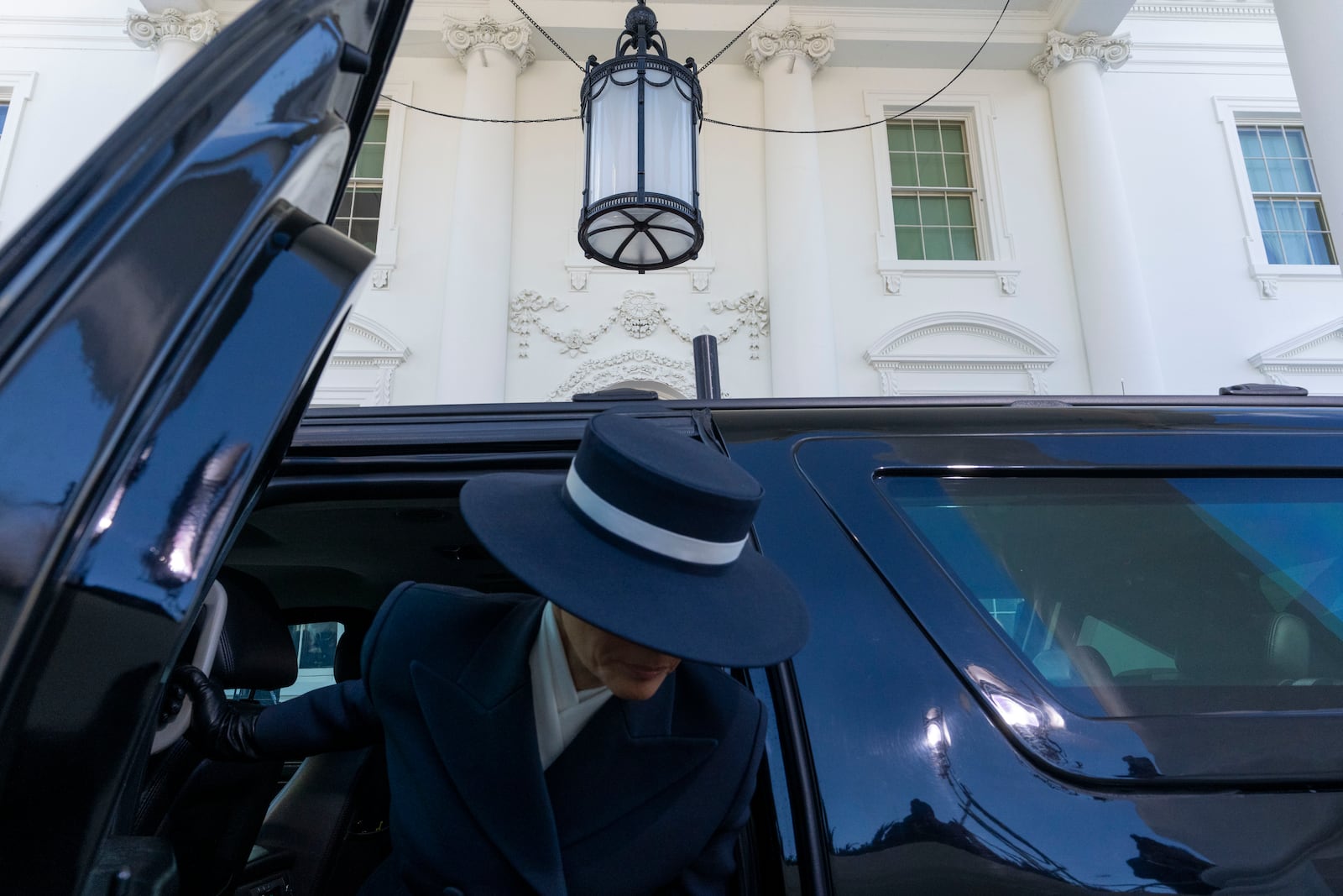 Melania Trump arrives with President-elect Donald Trump before being greeted by President Joe Biden and first lady Jill Biden, at the White House, Monday, Jan. 20, 2025, in Washington. (AP Photo/Alex Brandon)