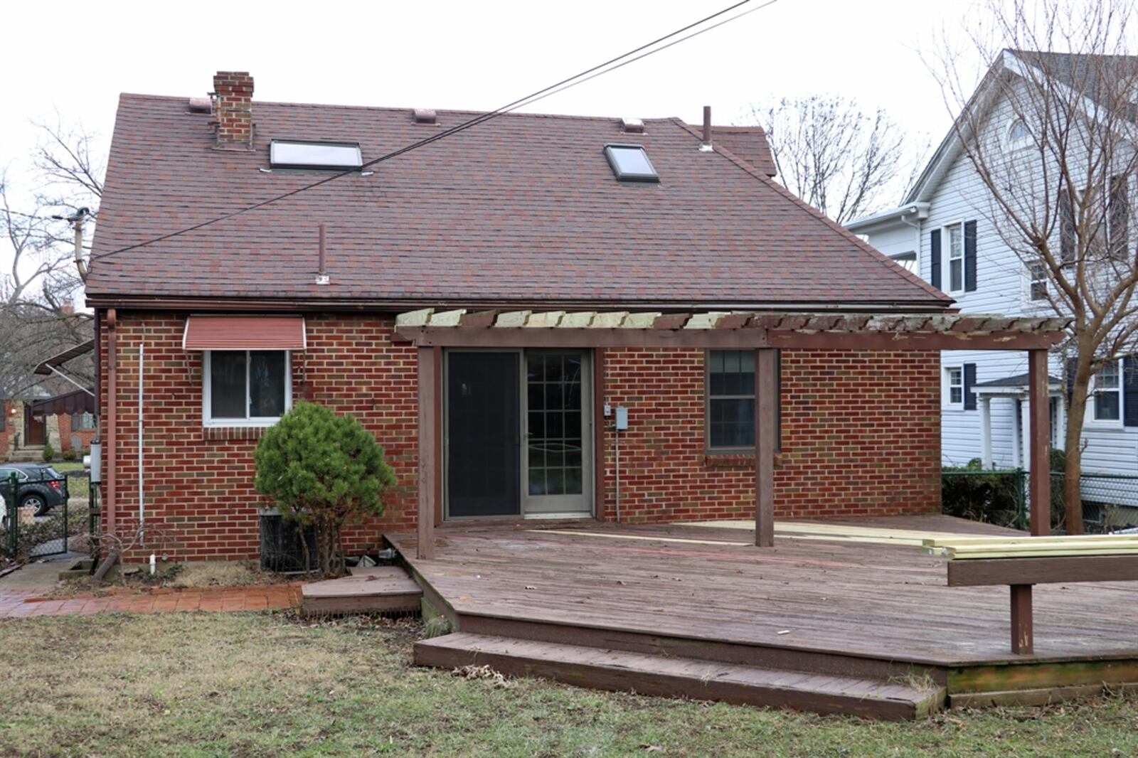 A large wooden deck with pergola is currently having an upgrade with some boards being replaced; and once the weather breaks, the deck and pergola will be stained to match.