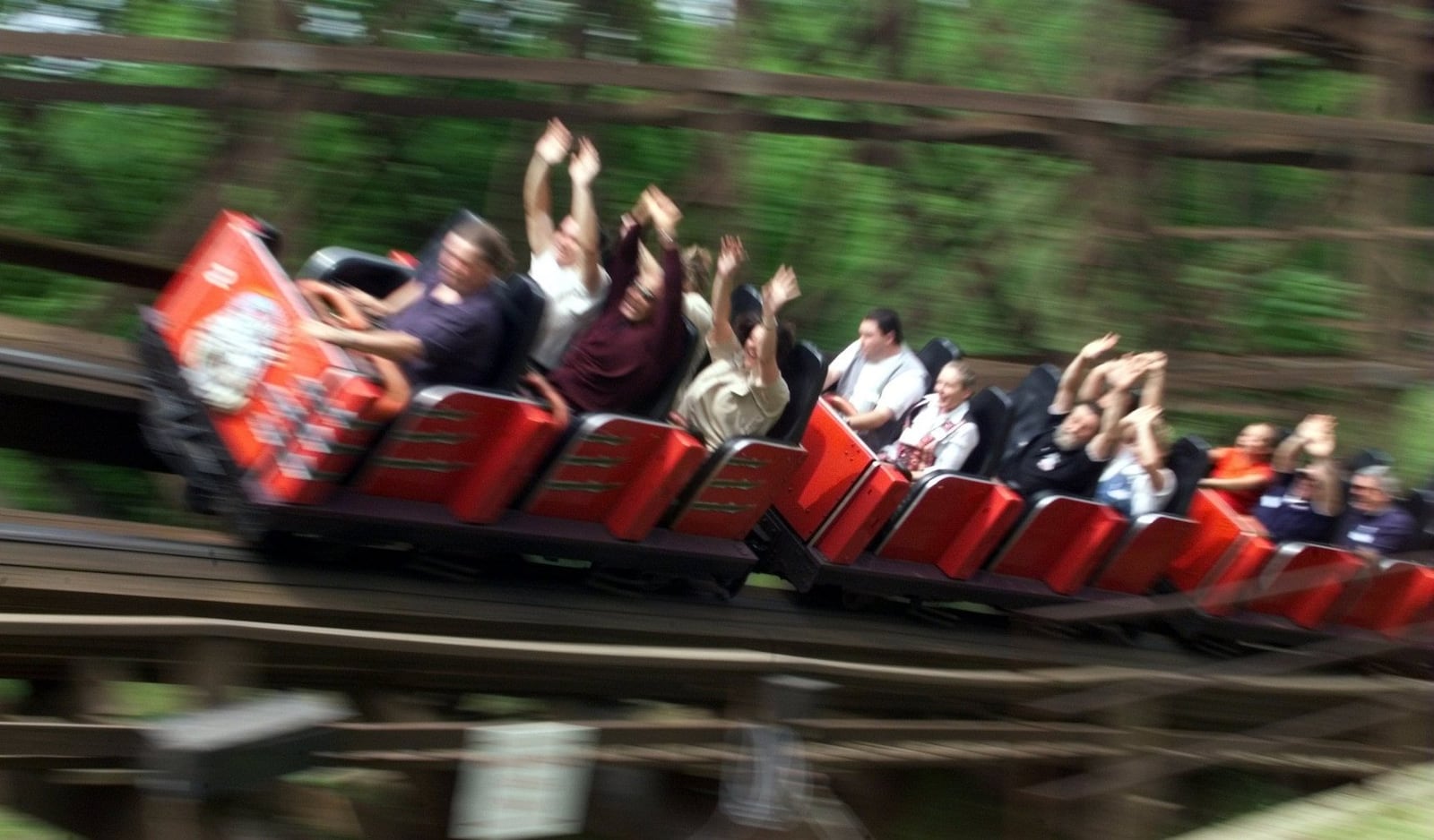 Riders on ‘The Beast’ hurl by after dropping 135 feet at a 45 degree angle. The roller coaster is the longest wooden roller coater in the world.