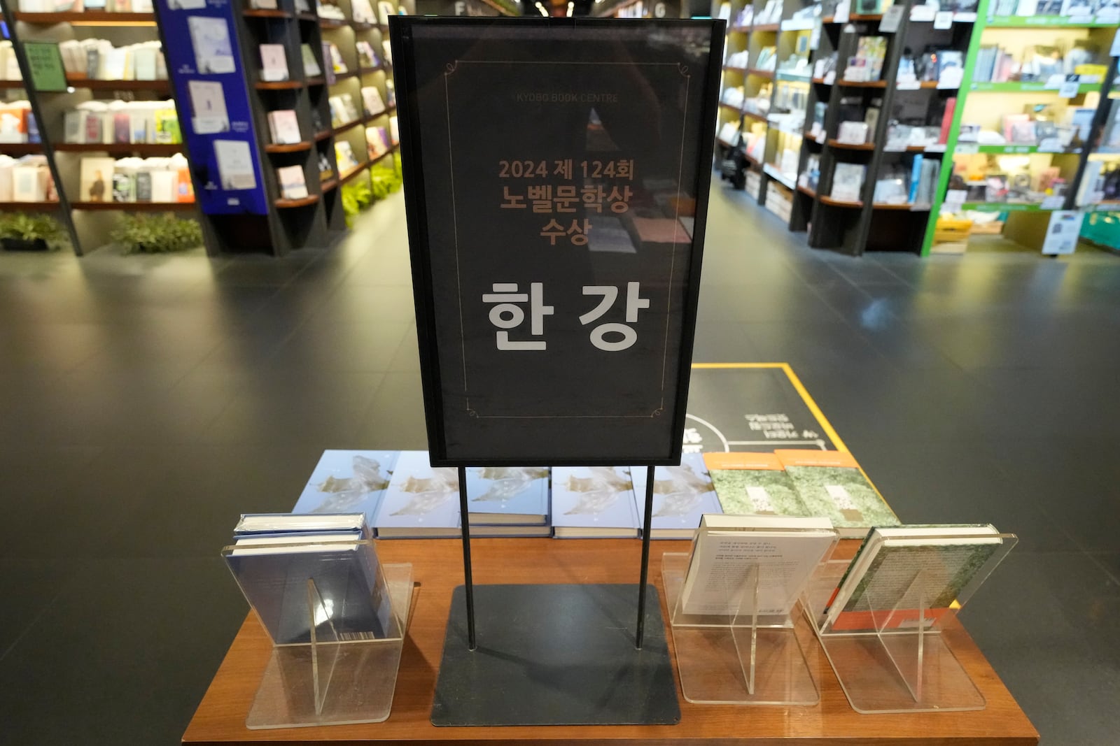 South Korean author Han Kang's books are displayed at a special section at a bookstore in Goyang, South Korea, Thursday, Oct. 10, 2024. The letters read "Han Kang, Awarded the Nobel Prize in literature." (AP Photo/Lee Jin-man)