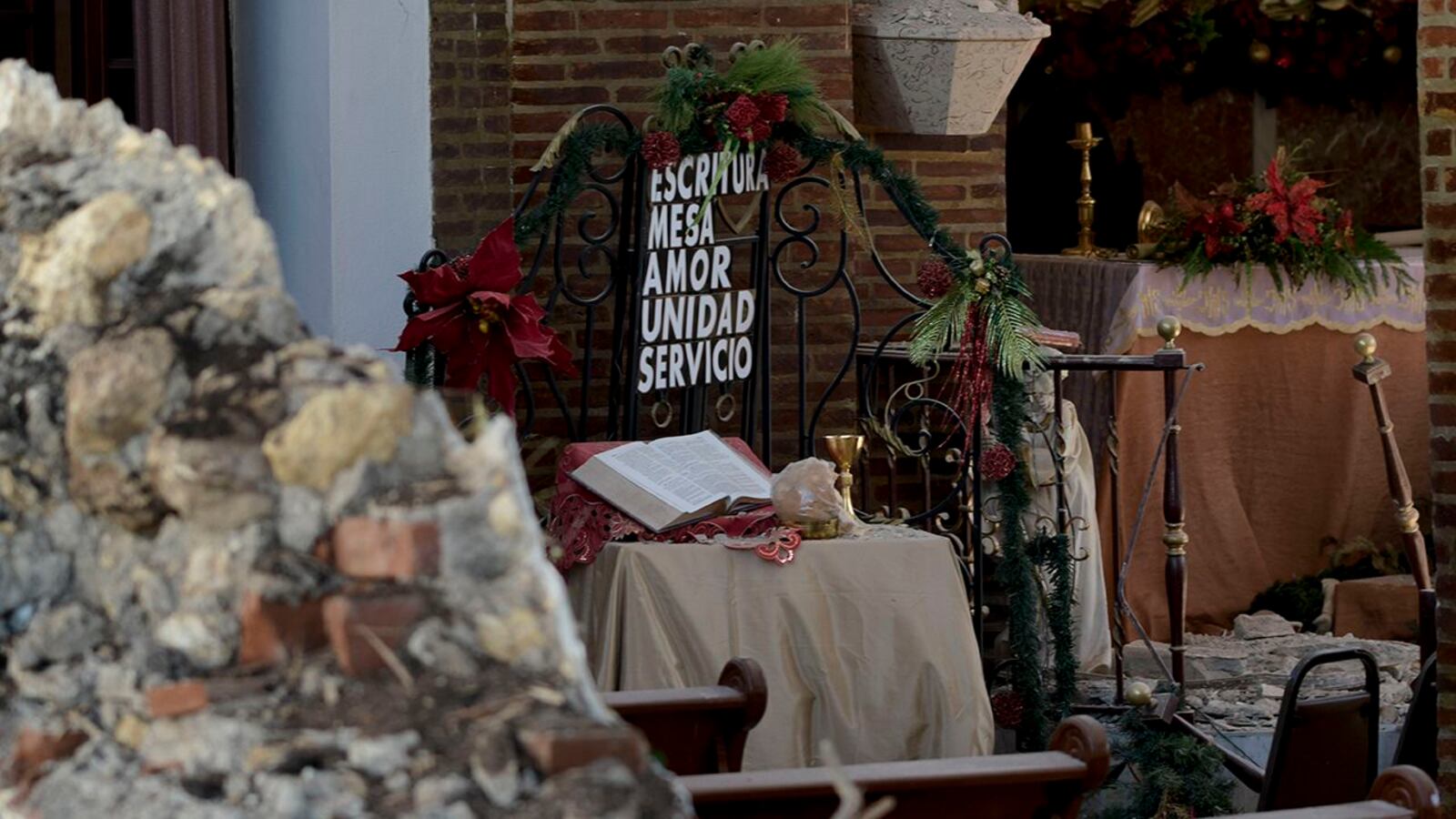 A helicopter flies over the Inmaculada Concepcion church, seen partially collapsed after an earthquake hit the island in Guayanilla, Puerto Rico, on January 7, 2020.