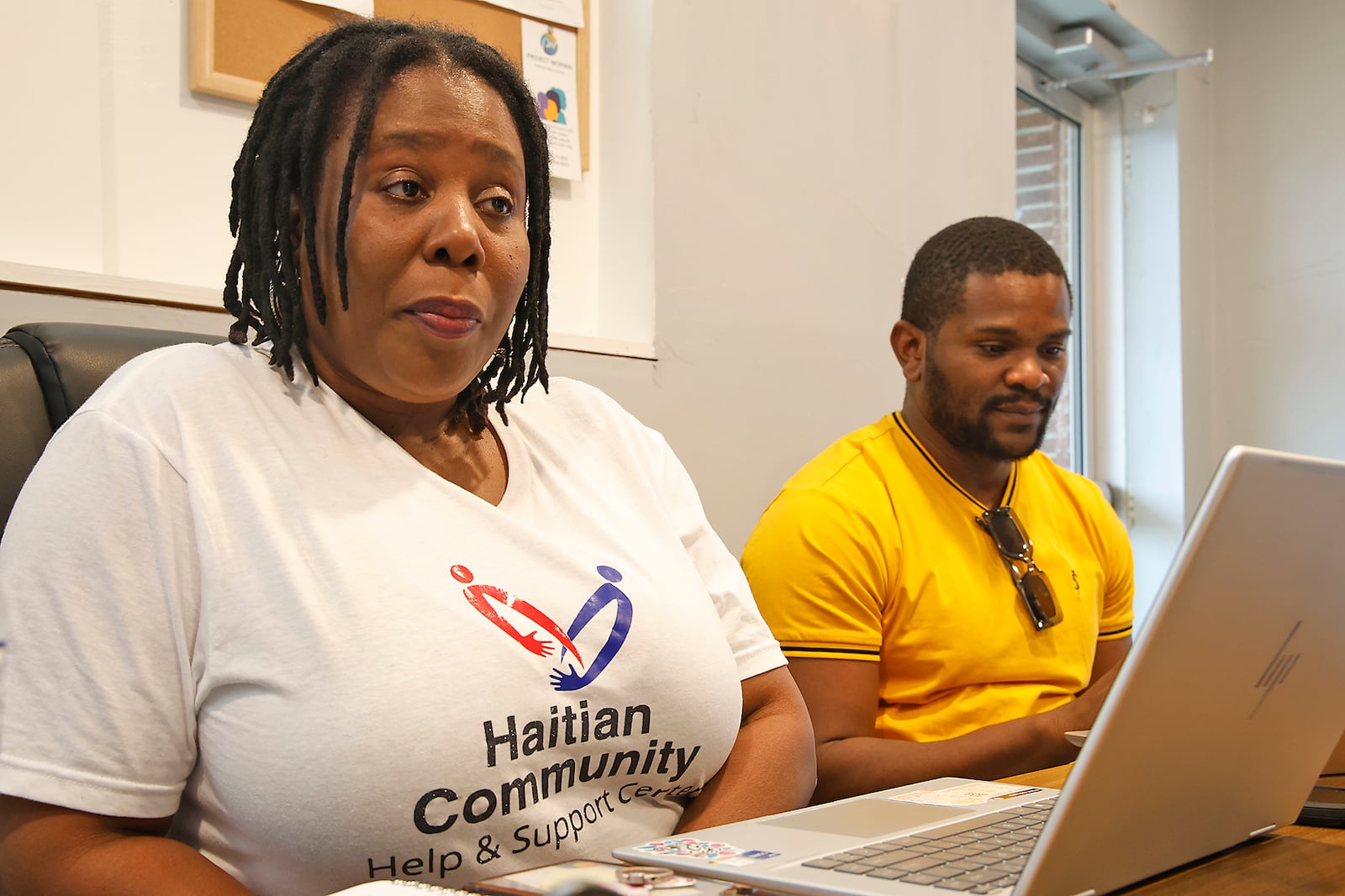 Haitian Community Center board members, Rose-Thamar Joseph and Lindsay Aime discuss the Haitian community Wednesday, June 5, 2024 at the community center on South Yellow Springs Street. BILL LACKEY/STAFF