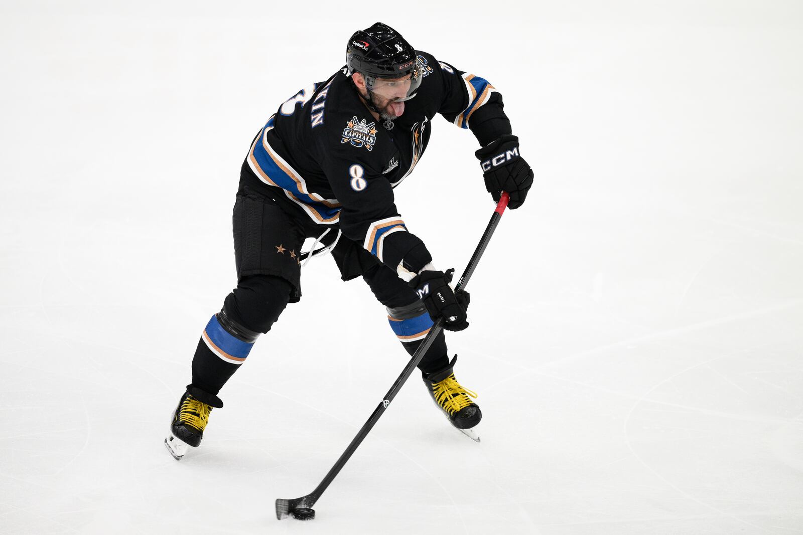 Washington Capitals left wing Alex Ovechkin (8) skates with the puck during the third period of an NHL hockey game against the Nashville Predators, Wednesday, Nov. 6, 2024, in Washington. The Capitals won 3-2. (AP Photo/Nick Wass)