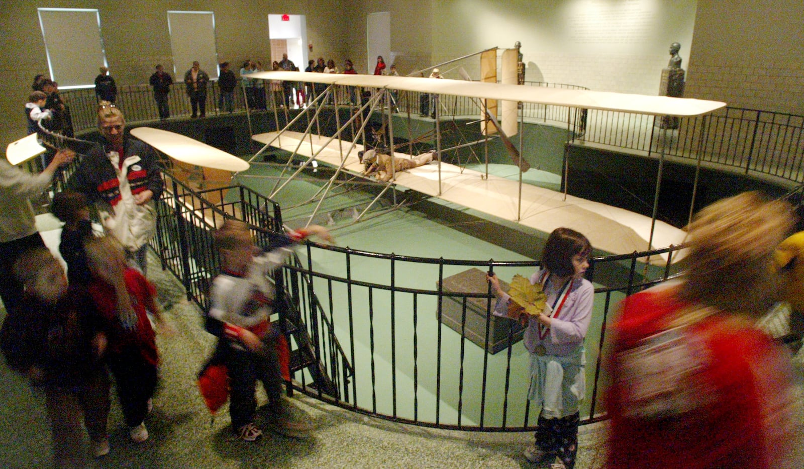 School groups view the original 1905 Wright Flyer III Thursday in the John W. Berry, Sr. Wright Brothers Aviation Center at Carillon Historical Park. CHRIS STEWART / STAFF