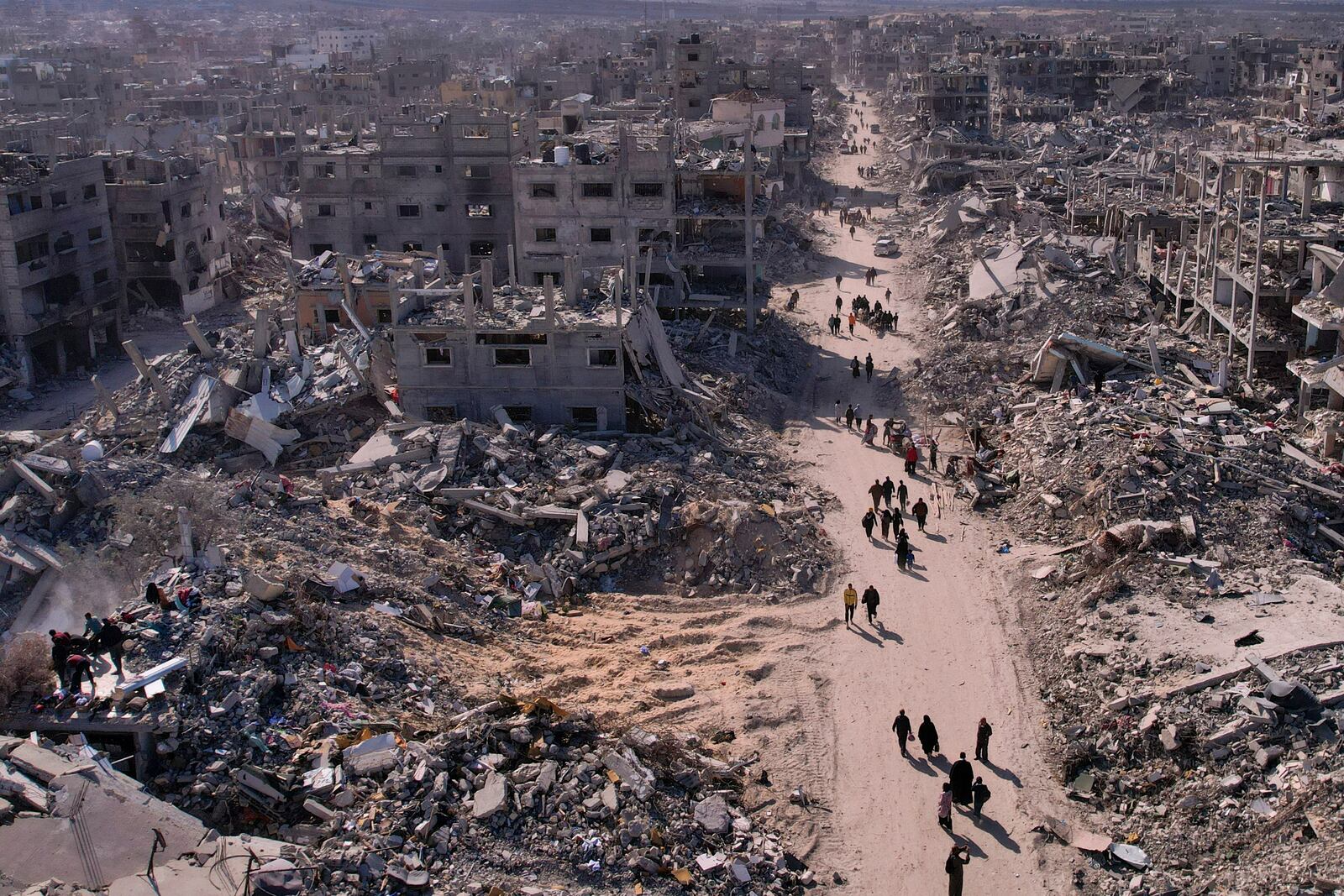 An aerial photograph taken by a drone shows displaced Palestinians returning to Rafah, a day after the ceasefire deal between Israel and Hamas came into effect, Gaza Strip, Monday, Jan. 20, 2025. (AP Photo/Mohammad Abu Samra)