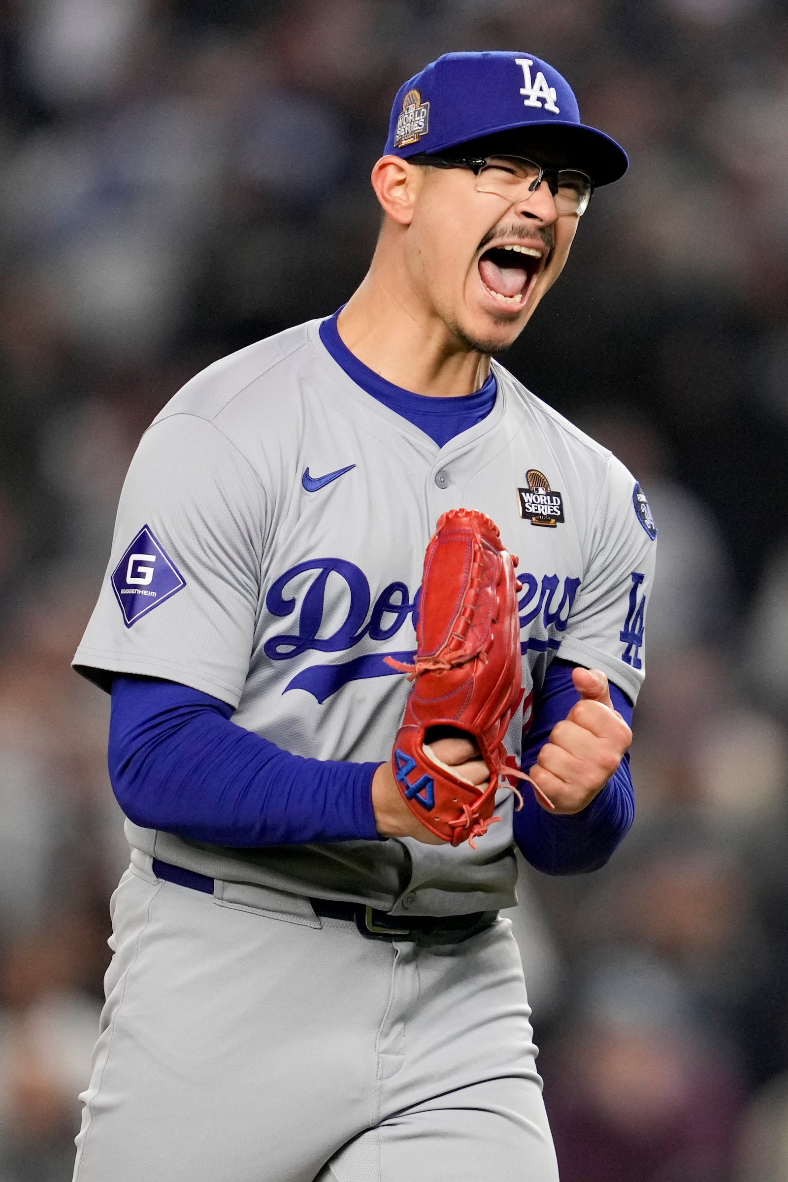 Los Angeles Dodgers pitcher Anthony Banda celebrates the end of the seventh inning in Game 3 of the baseball World Series against the New York Yankees, Monday, Oct. 28, 2024, in New York. (AP Photo/Ashley Landis)