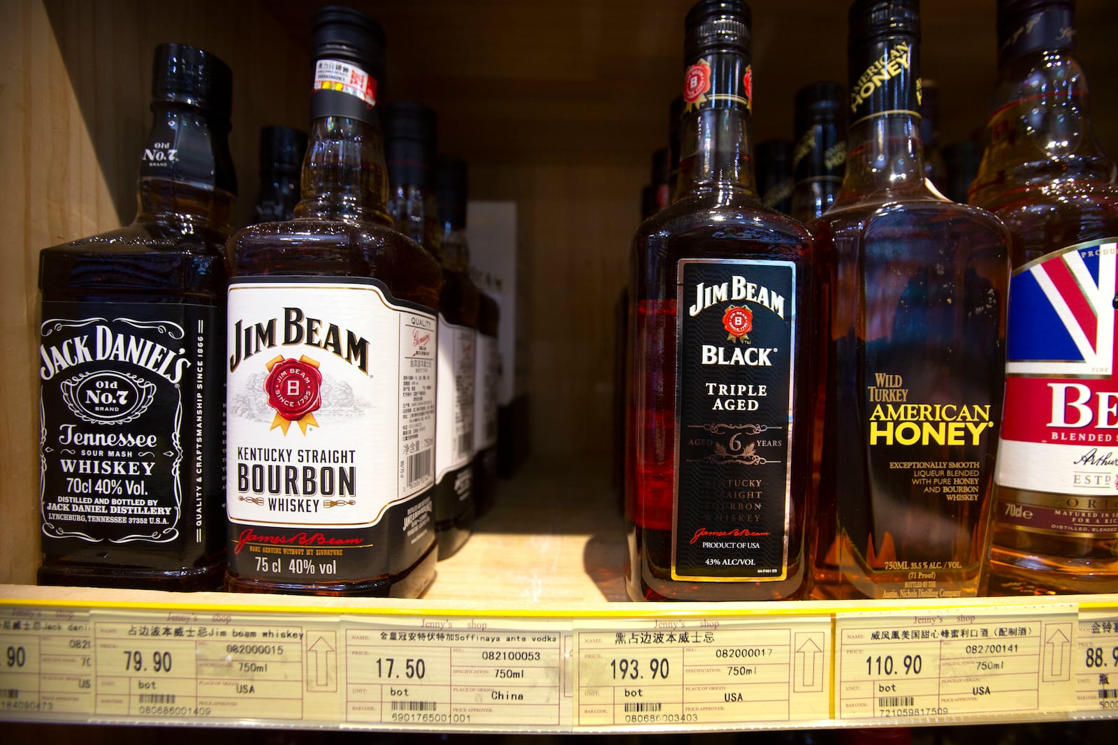 FILE - In this July 7, 2018 file photo whiskeys distilled and bottled in the U.S. are displayed for sale in a grocery store in Beijing. (AP Photo/Mark Schiefelbein, file)