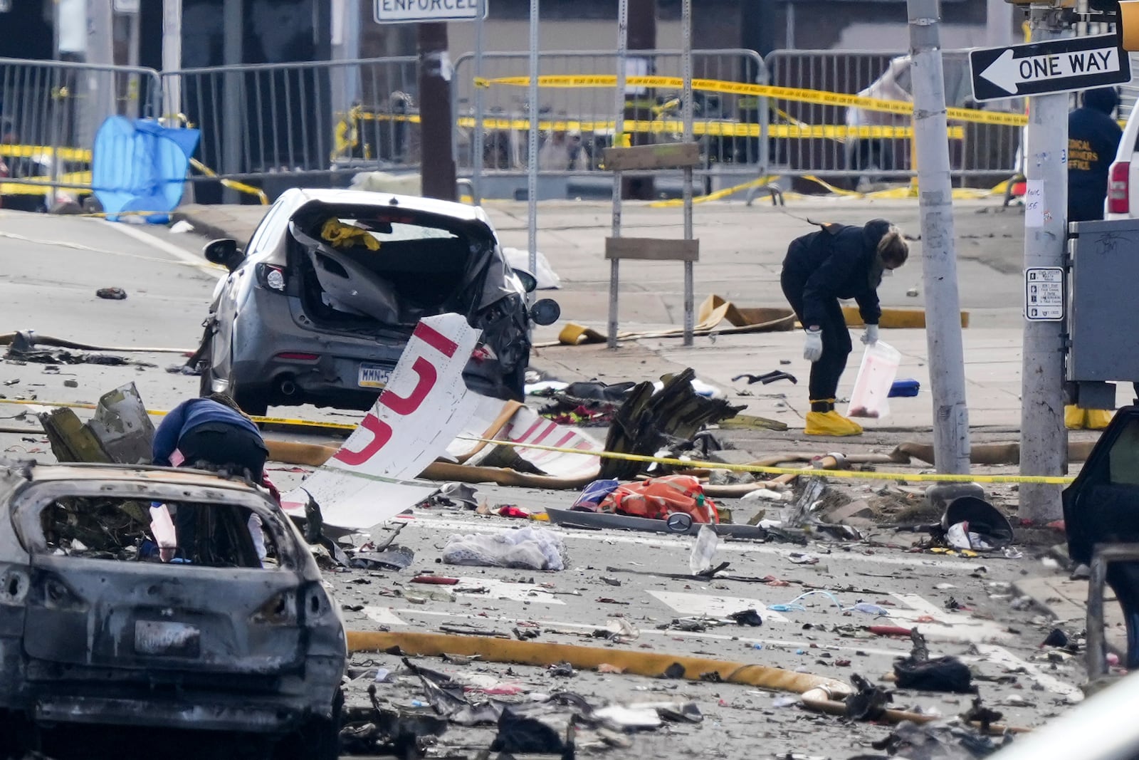 FILE - Investigators work the scene after a small plane crashed in Philadelphia, Feb. 1, 2025. (AP Photo/Matt Rourke, File)