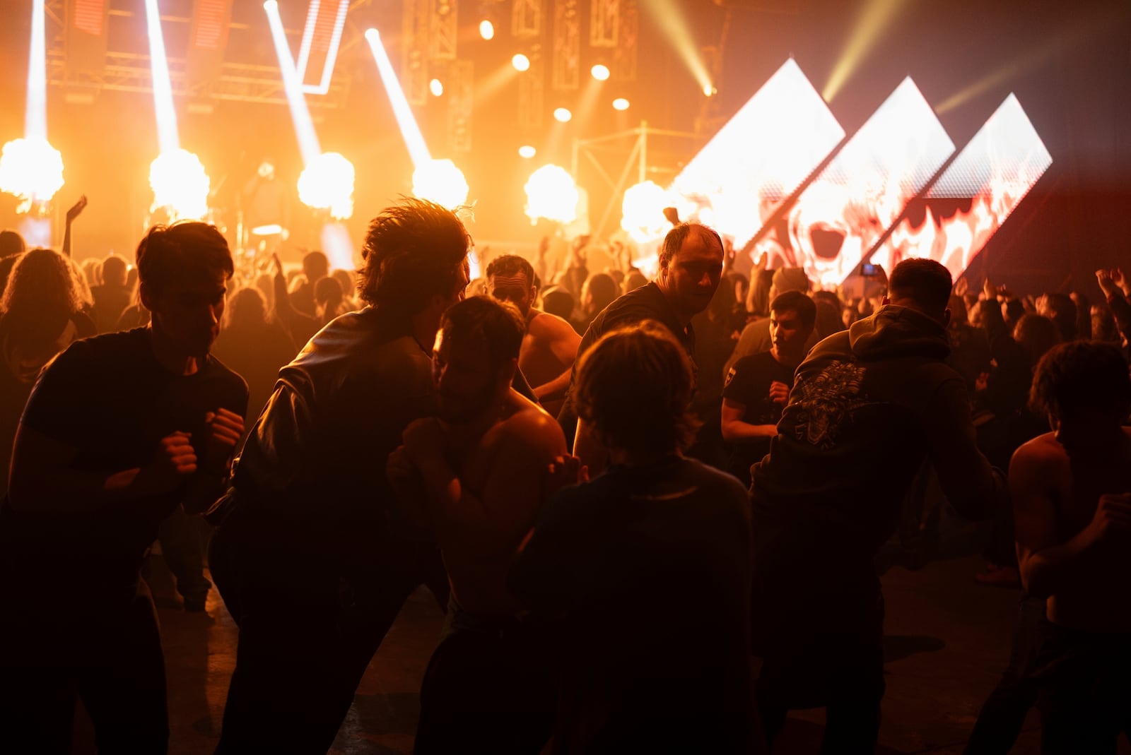 People slam during the presentation of the music album Epoch, a collaboration between Ukrainian artists and the 3rd Assault Brigade, in Kyiv, Ukraine, Saturday, Dec. 7, 2024. (AP Photo/Alex Babenko)