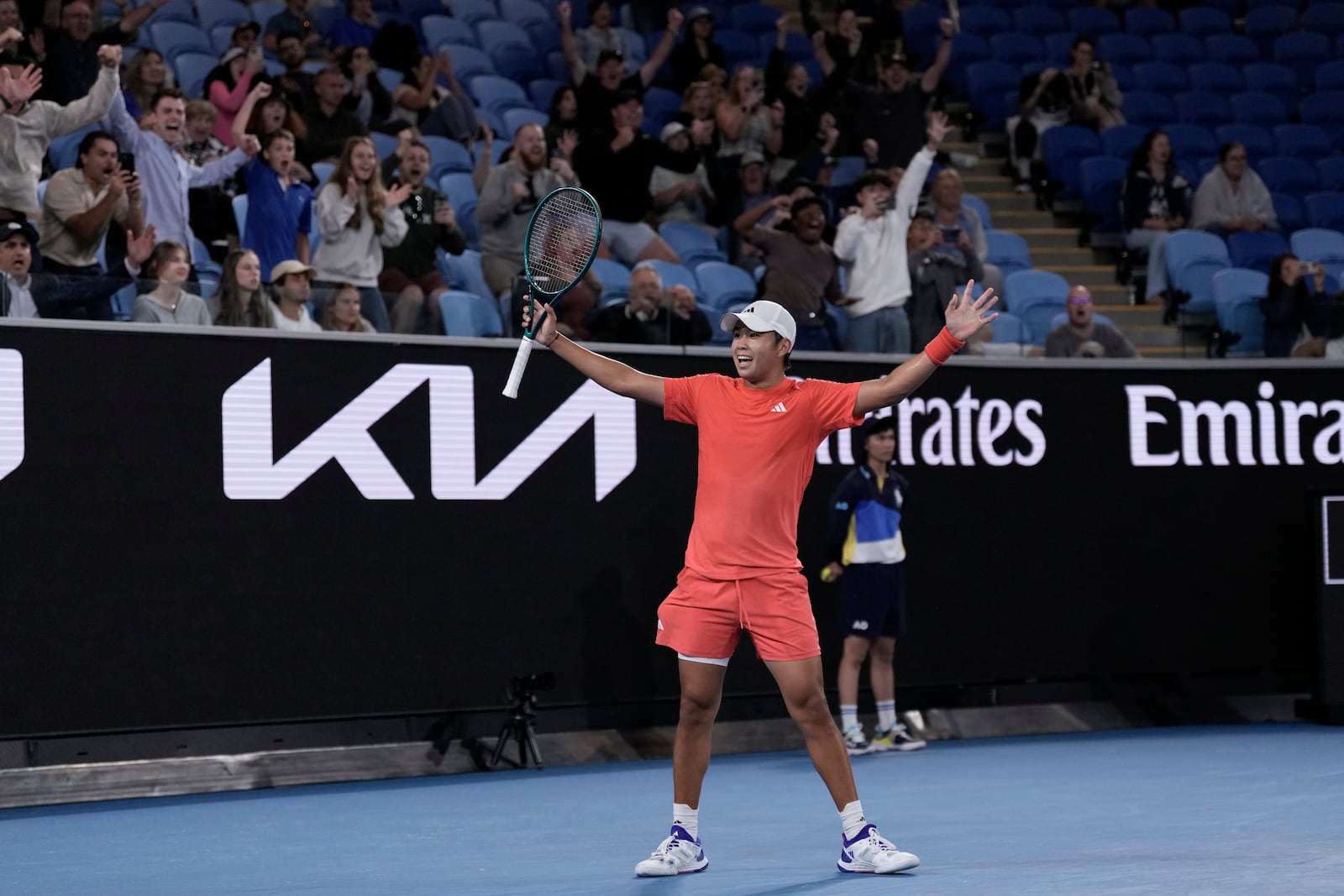 Learner Tien of the U.S. celebrates after winning his second round match against Daniil Medvedev of Russia at the Australian Open tennis championship in Melbourne, Australia, in the early hours of Friday, Jan. 17, 2025. (AP Photo/Ng Han Guan)