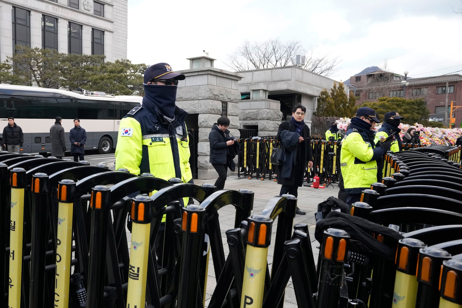 Police officers stand guard in front of the Constitutional Court in Seoul, South Korea, Tuesday, Feb. 25, 2025. (AP Photo/Ahn Young-joon)