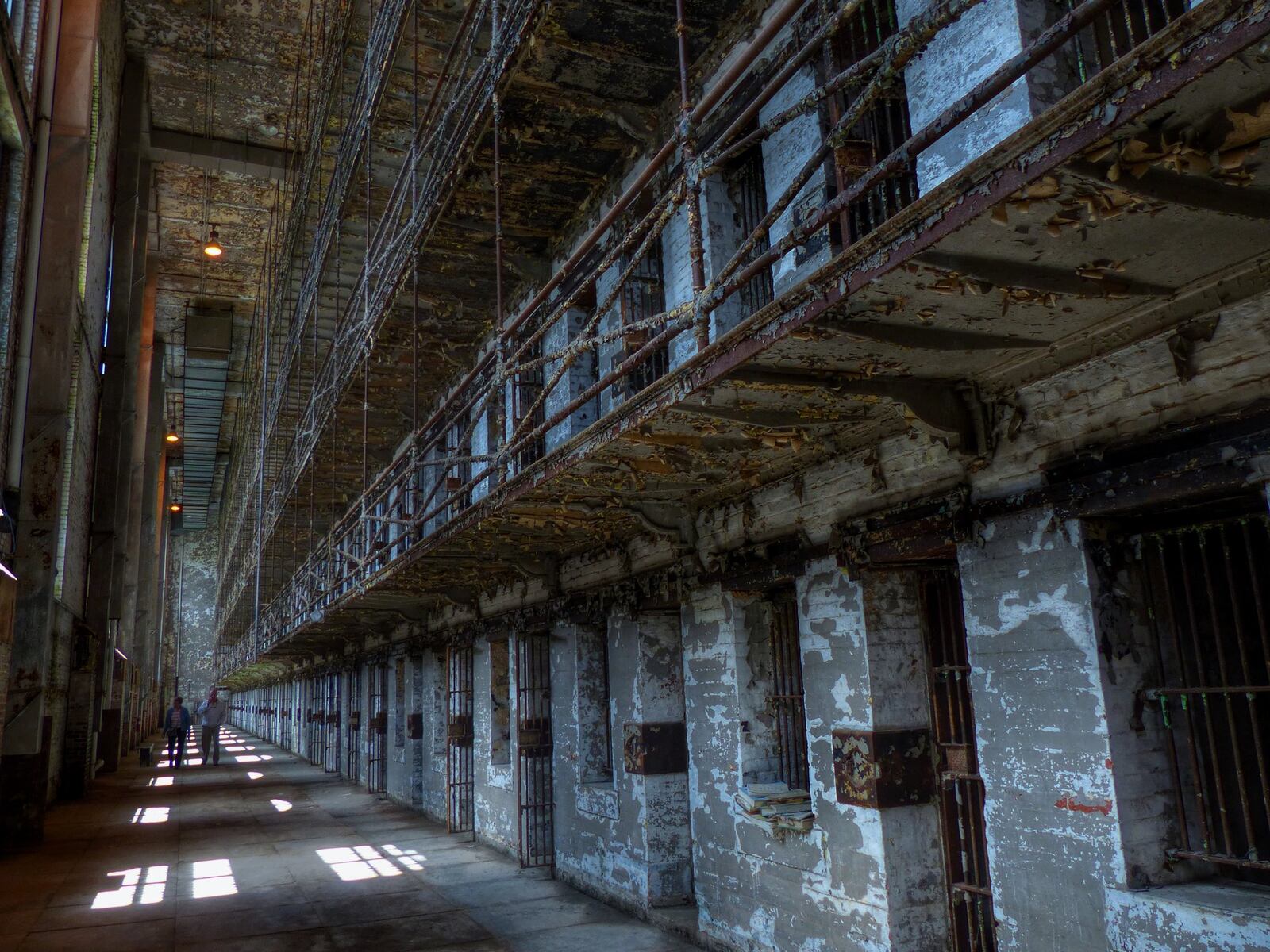 Layers upon layers of peeling paint reveal a glimpse of how the West Tower at the Ohio State Reformatory looked between 1895 and 1990, when more than 155,000 men did time. Visitors can peer into the small jail cells, which were large enough to accommodate a twin-size bed, toilet and small sink. CONNIE POST/STAFF