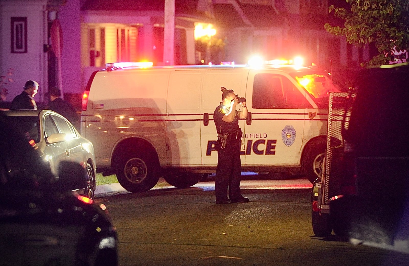 Springfield police collect evidence in the 200 block of Rosewood Avenue after a 20-year-old man was fatally shot Saturday night, July 8, 2023. MARSHALL GORBY \STAFF