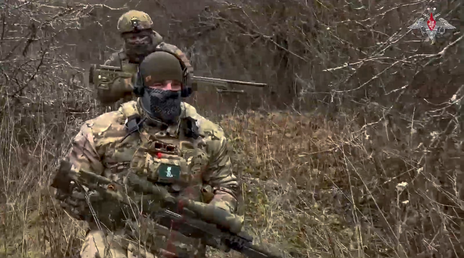 In this photo taken from video distributed by the Russian Defense Ministry Press Service on Saturday, Jan. 11, 2025, Russian snipers change a position to fire towards Ukrainian forces from an undisclosed location. (Russian Defense Ministry Press Service via AP)