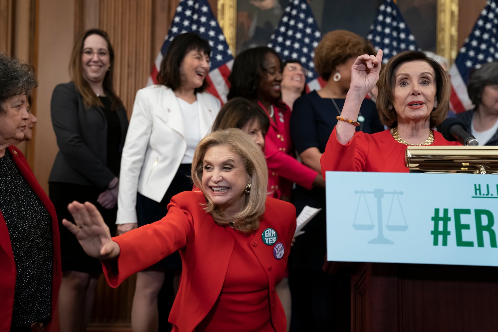 FILE - Speaker of the House Nancy Pelosi, D-Calif., joined at left by Rep. Carolyn Maloney, D-N.Y., and other congressional Democrats, holds an event about their resolution to remove the deadline for ratification of the Equal Rights Amendment, at the Capitol in Washington, Wednesday, Feb. 12, 2020. (AP Photo/J. Scott Applewhite, File)