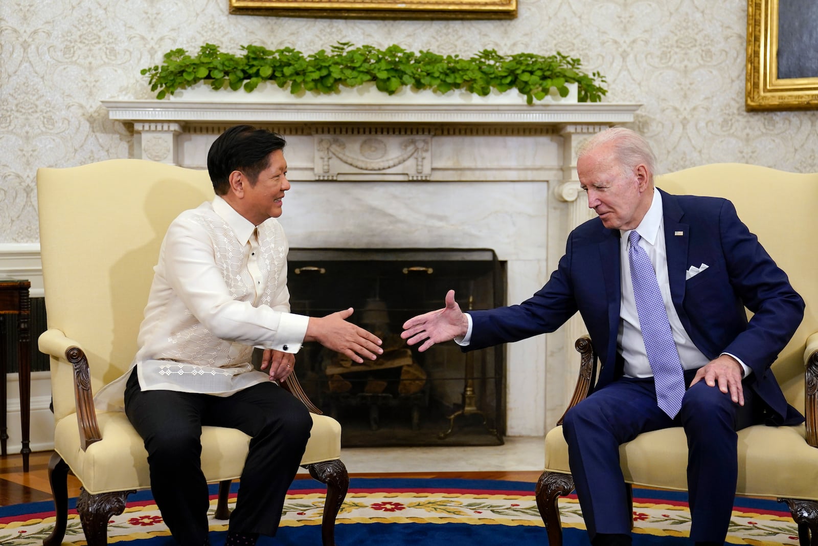 FILE - President Joe Biden, right, shakes hands with Philippines President Ferdinand Marcos Jr. as they meet in the Oval Office of the White House in Washington, on May 1, 2023. (AP Photo/Carolyn Kaster, File)