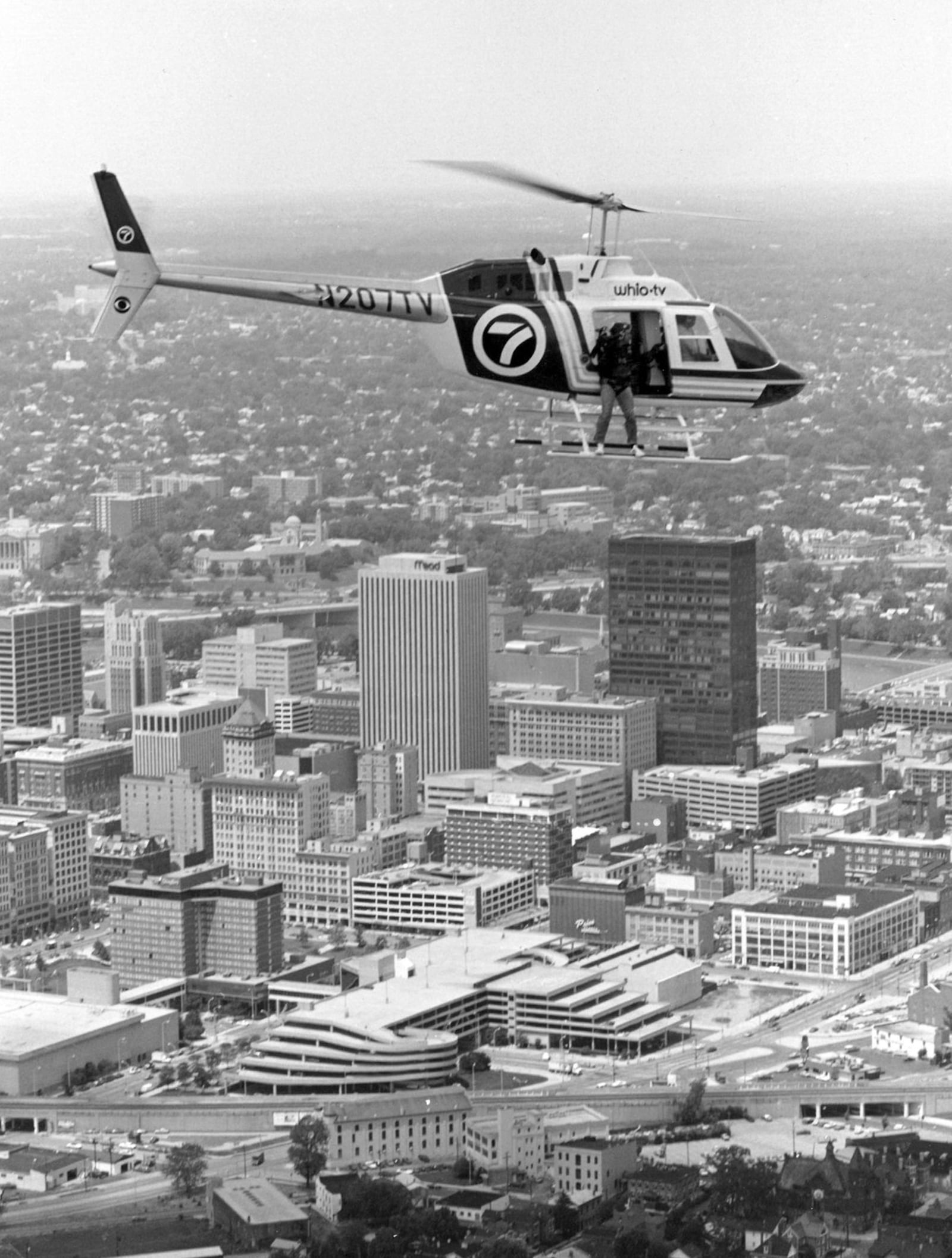 Byron Stirsman, a long-time videographer for WHIO-TV, covers a story from News Chopper 7 flying over Dayton. PHOTO: WHIO-TV