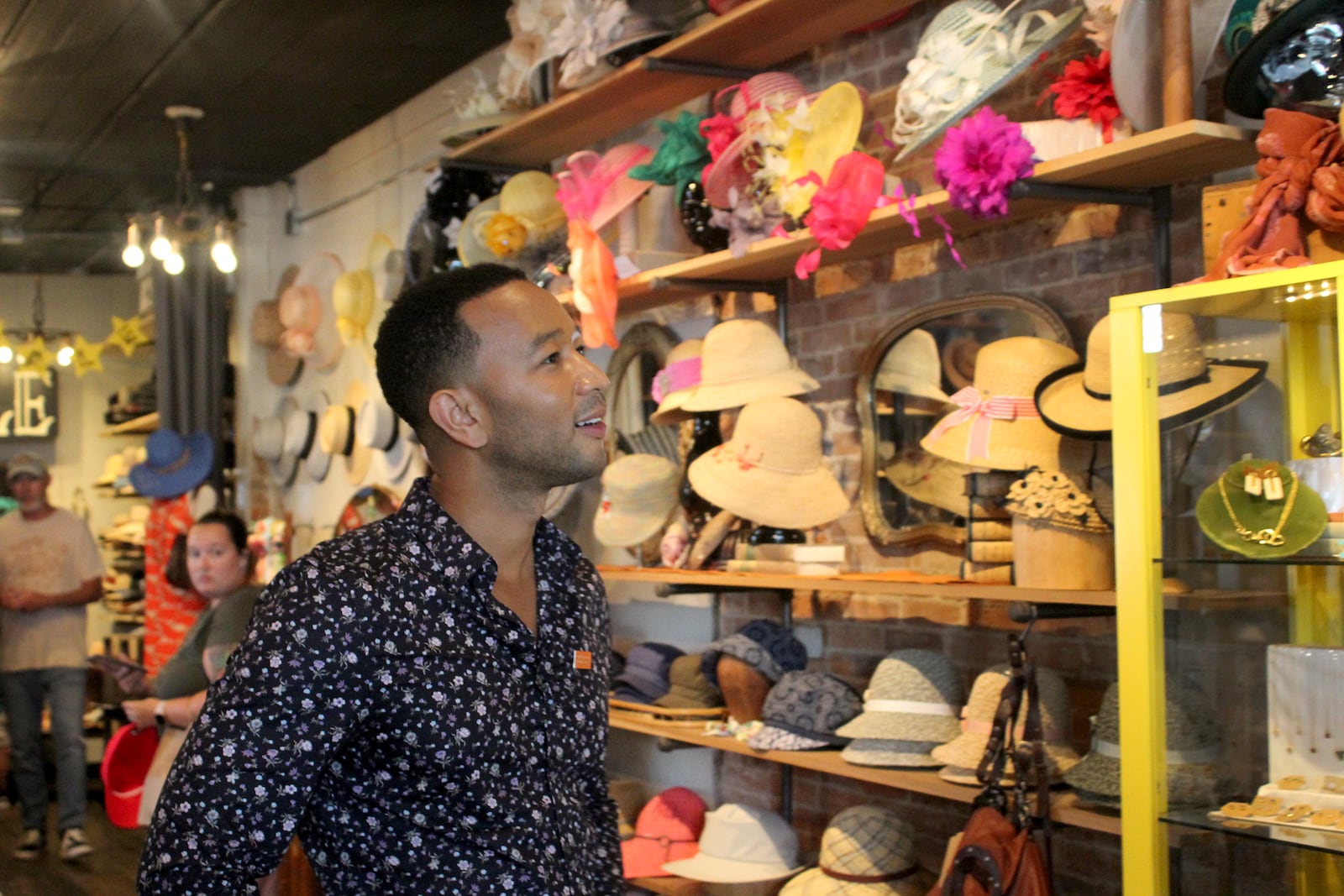 John Legend made a surprise visit to the Oregon District Sunday evening with Dayton Mayor Nan Whaley to show support in the aftermath of the mass shooting Sunday, Aug. 4. He stopped by a number of stores to shop including Heart Mercantile, Brim on Fifth, Puff Apothecary and Beck + Call. AMELIA ROBINSON / STAFF