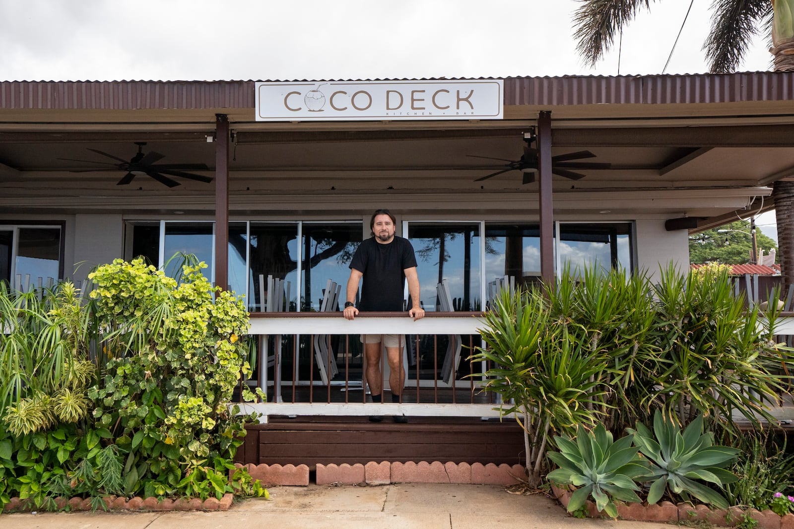 Javier Barberi, one of the owners of Mala Ocean Tavern, Coco Deck, and Pizza Paradiso, poses for a picture at Coco Deck, Monday, Nov. 18, 2024, in Lahaina, Hawaii. Barberi looks forward to the Maui Invitational, where Pizza Paradiso will be one of the food vendors. (AP Photo/Mengshin Lin)