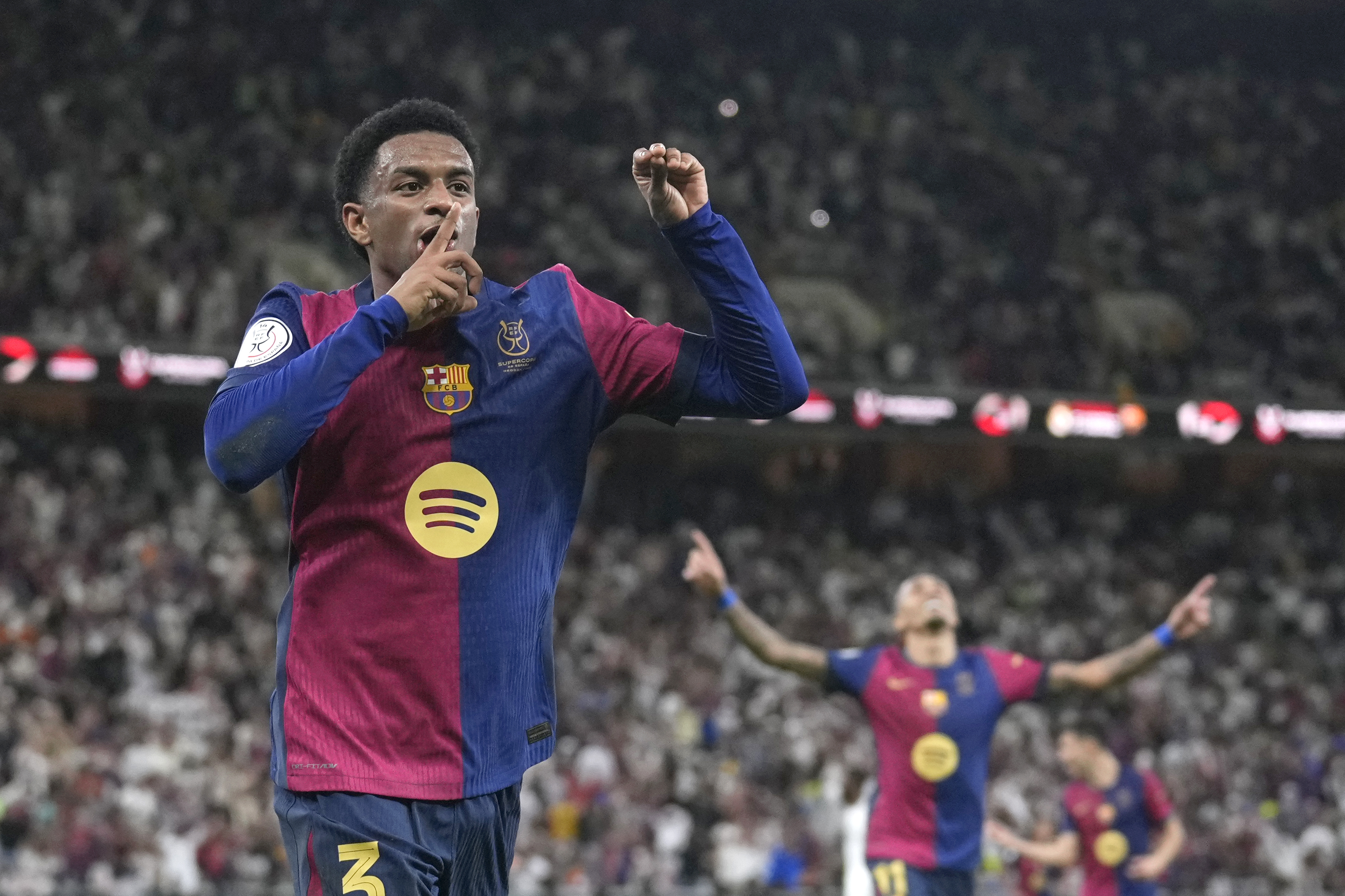 Barcelona's Alejandro Balde celebrates after scoring his side's fourth goal during the Spain Super Cup final soccer match between Real Madrid and Barcelona at King Abdullah Stadium in Jeddah, Saudi Arabia, Sunday, Jan. 12, 2025. (AP Photo/Altaf Qadri)